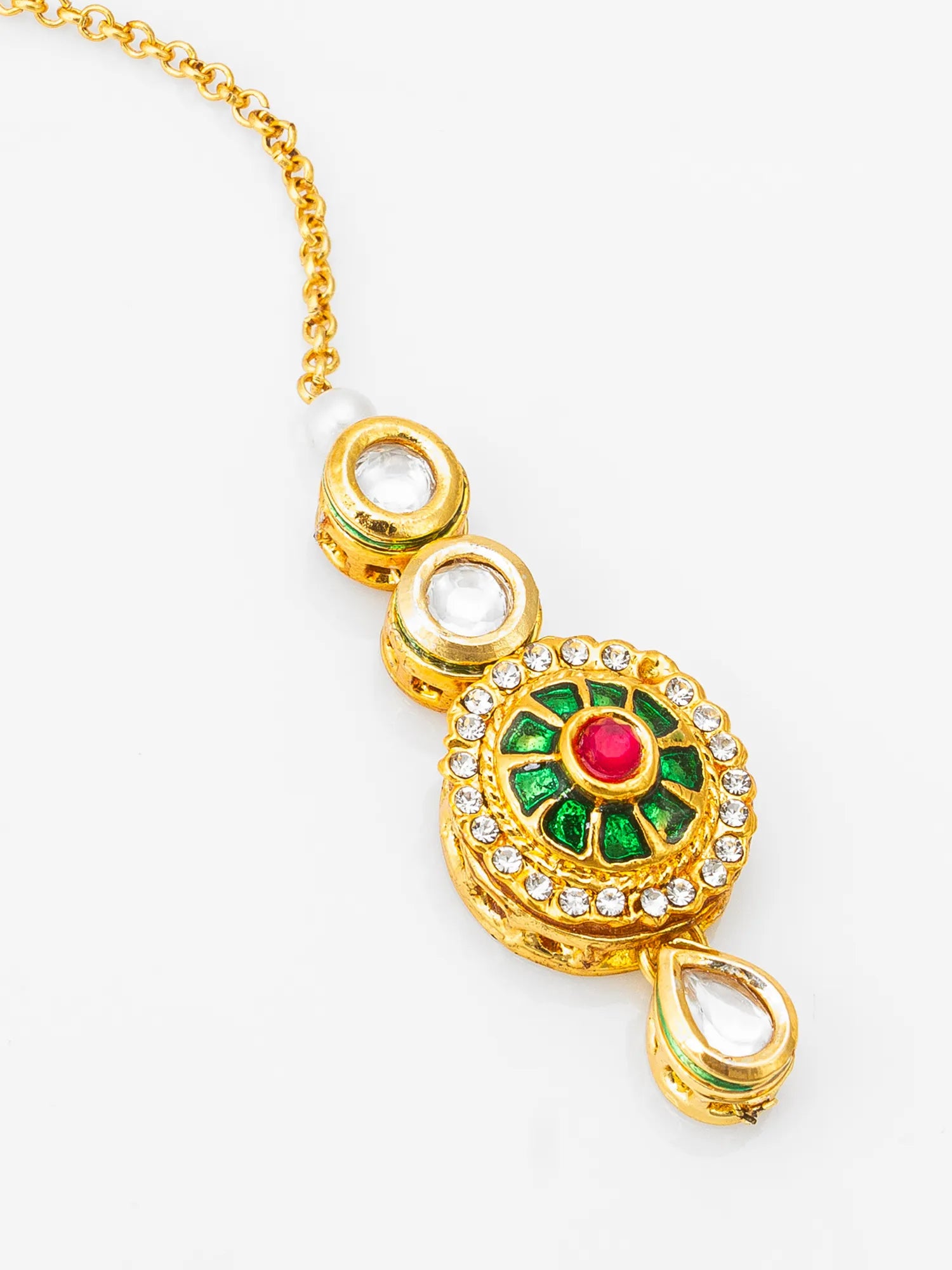 Gold necklace with a decorative pendant featuring green and red stones on a white background