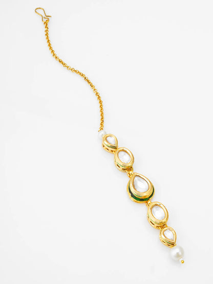 Gold necklace with green and pearl accents on a white background