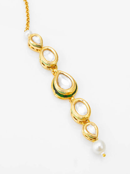 Gold necklace with green and white stones on a white background