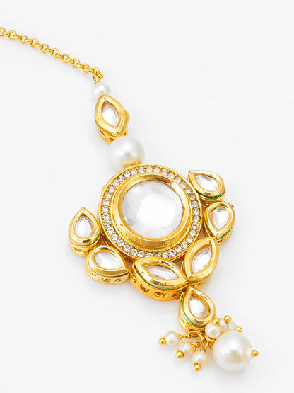Gold necklace with a central pendant featuring pearls and gemstones on a white background
