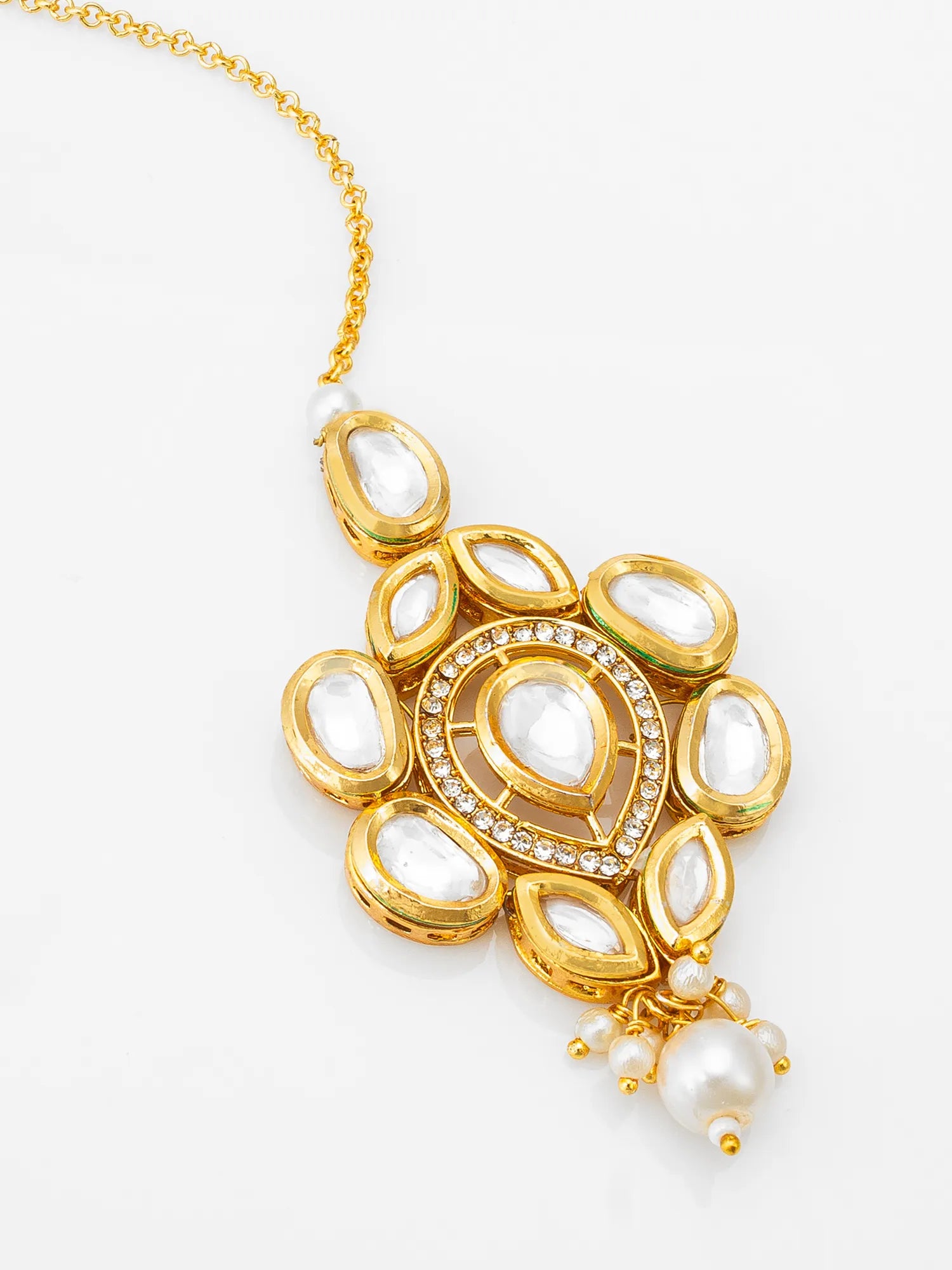 Gold necklace with intricate design and pearl pendant on a white background