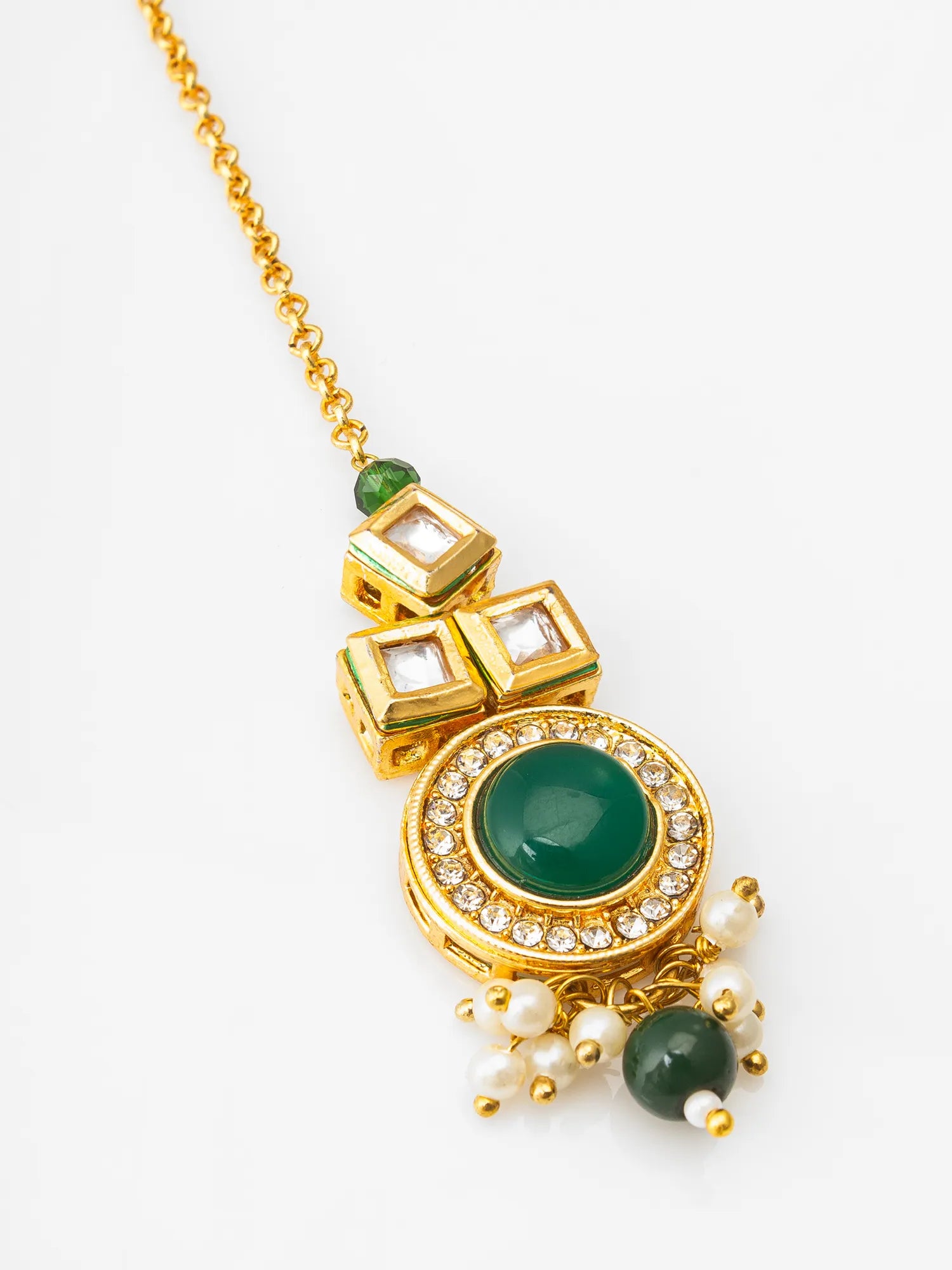 Gold necklace with green gemstones and pearl-like beads on a white background