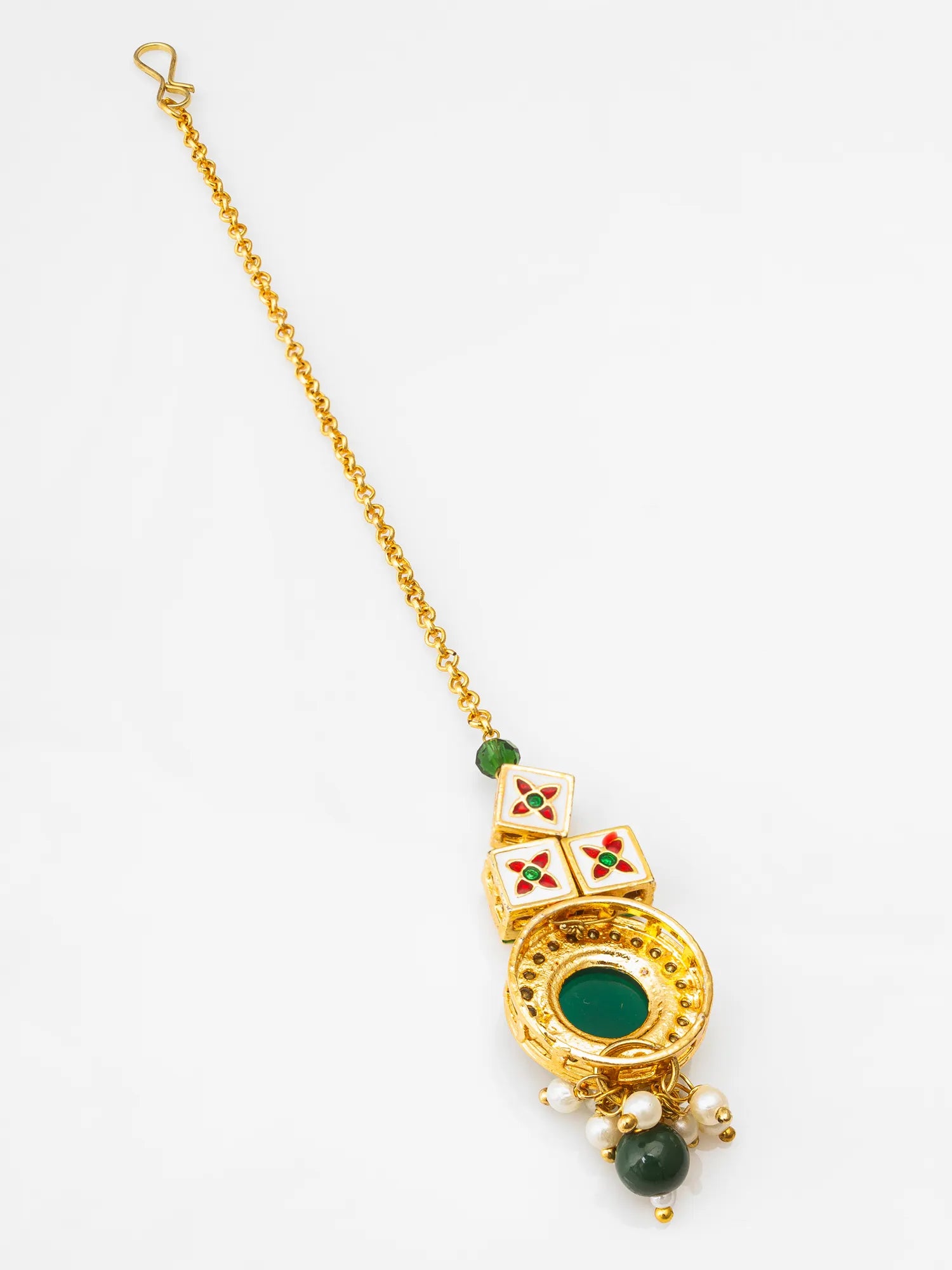 Gold necklace with green gemstones on a white background