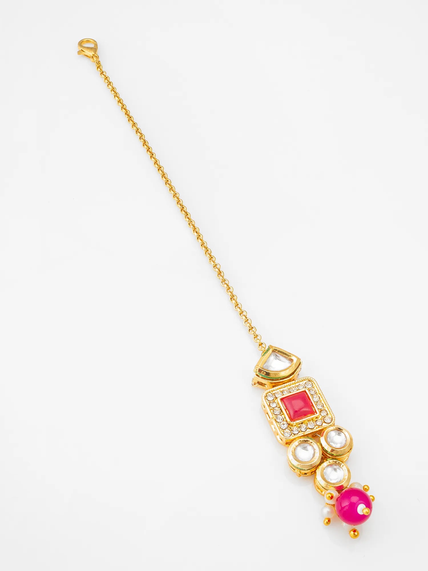 Gold necklace with a red gemstone and pearl pendant on a white background