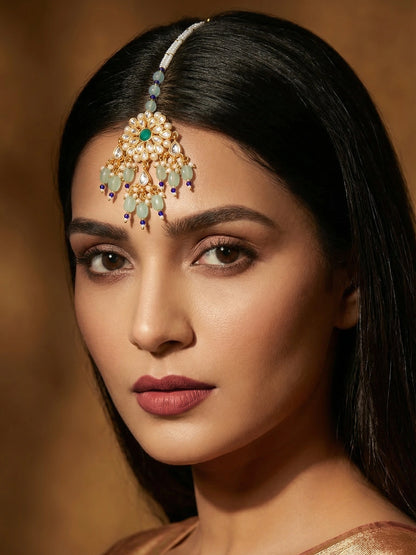 Aadita Gold Plated Kundan Flower Mangtika with Mint Green Bead Drops and Blue Crystal Chain