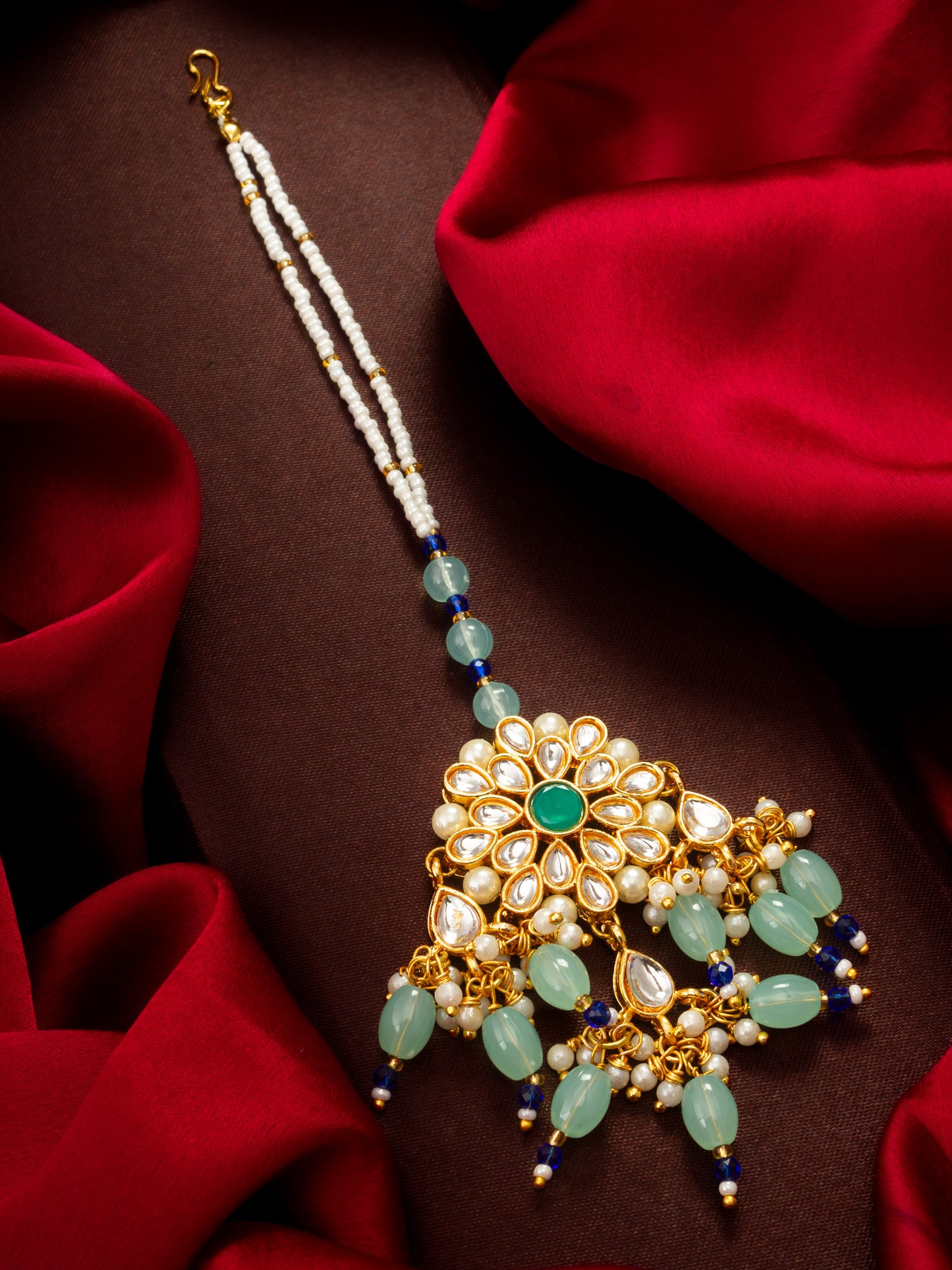 Aadita Gold Plated Kundan Flower Mangtika with Mint Green Bead Drops and Blue Crystal Chain