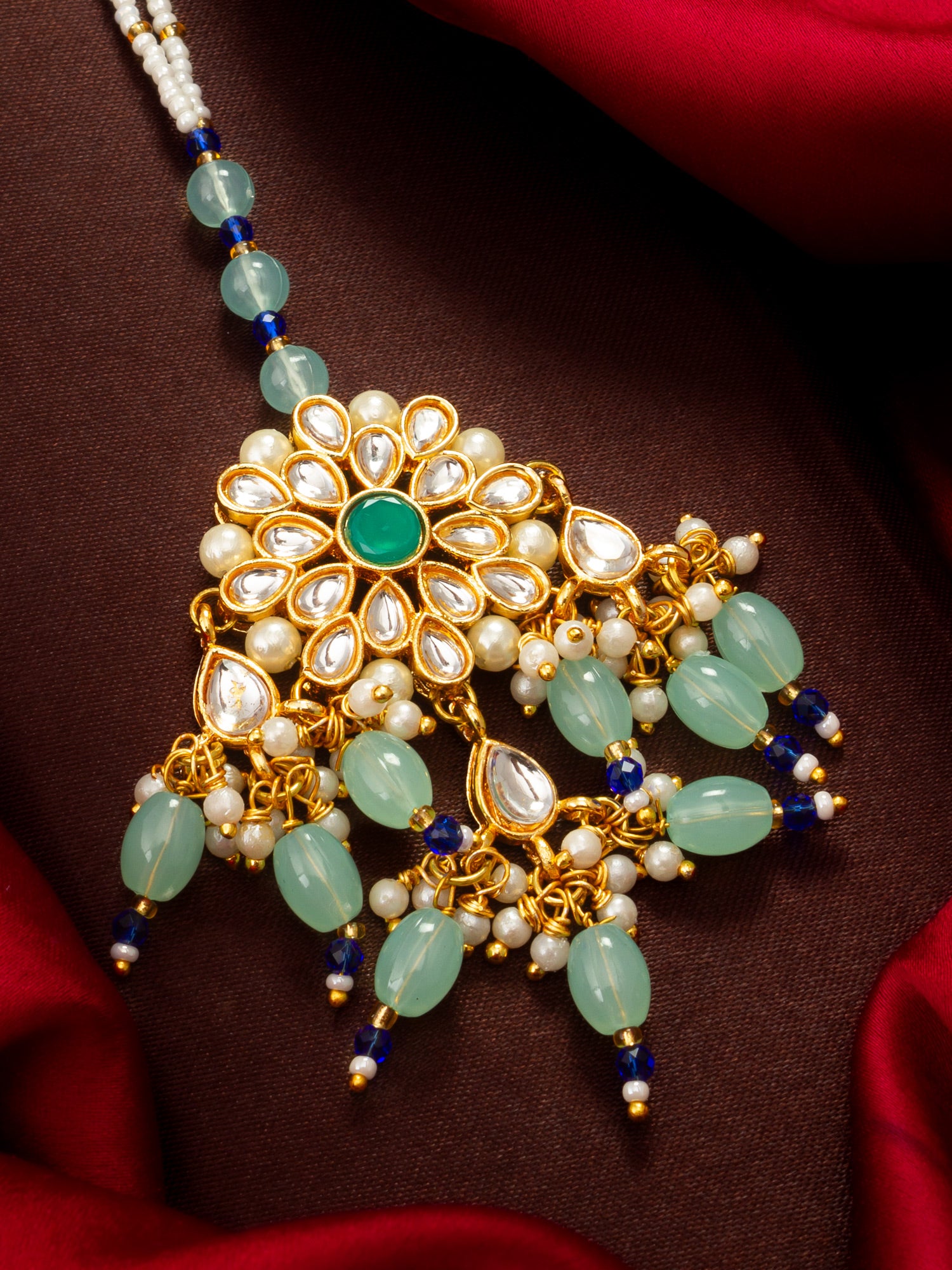 Aadita Gold Plated Kundan Flower Mangtika with Mint Green Bead Drops and Blue Crystal Chain