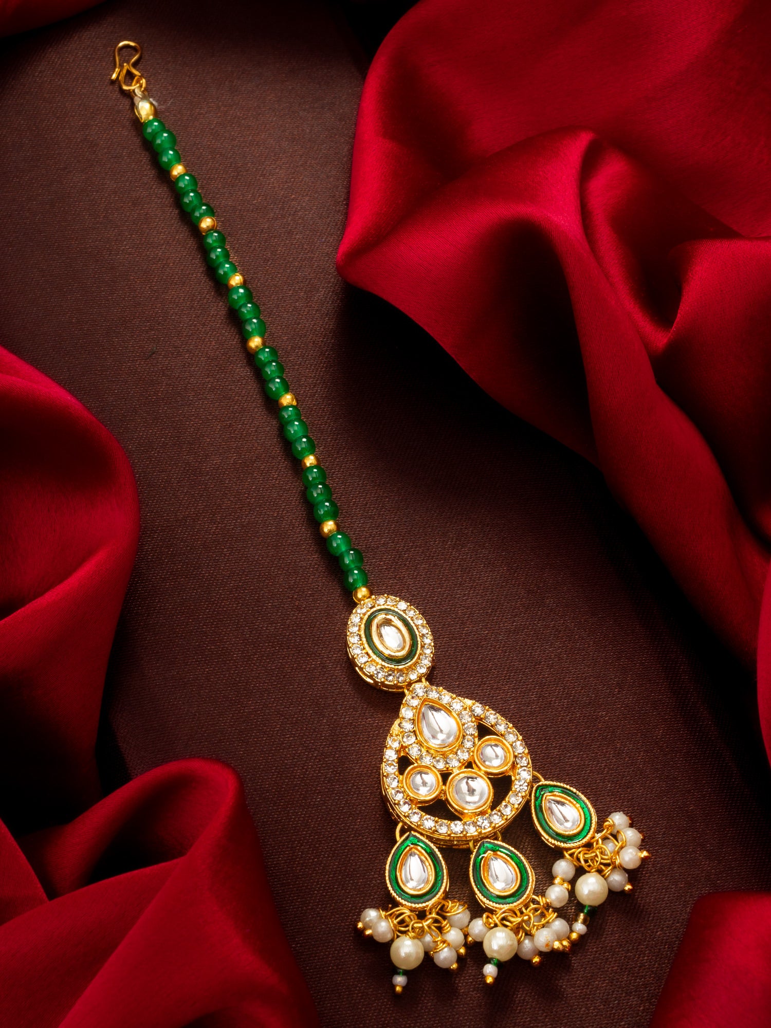 Aadita Gold Plated Kundan Chandbali-Style Mangtika with Green Bead Chain and Pearl Drops