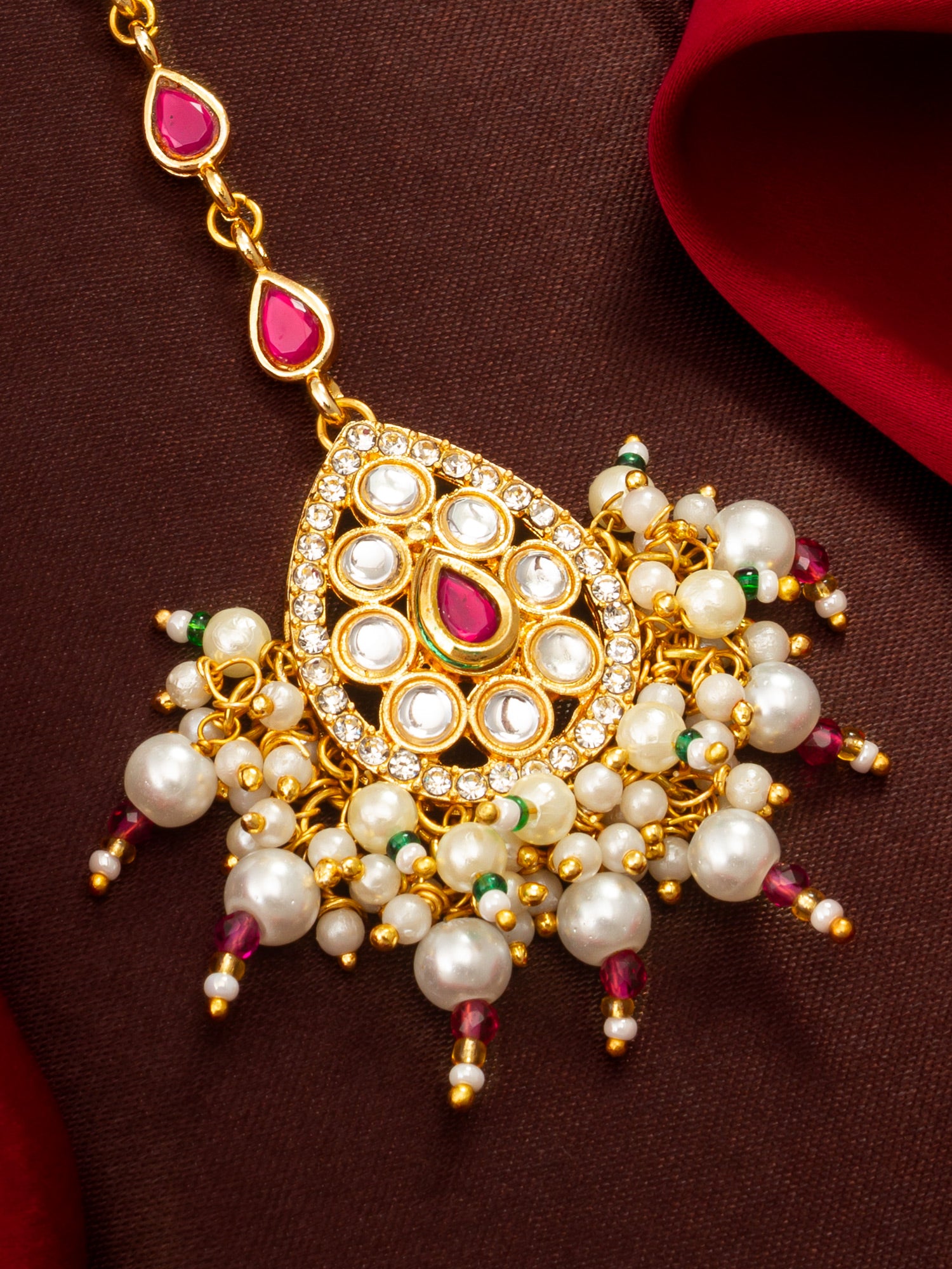 Aadita Gold Plated Ruby Teardrop Chain Mangtika with Kundan Triangle Pendant and Pearl Cluster Fringe
