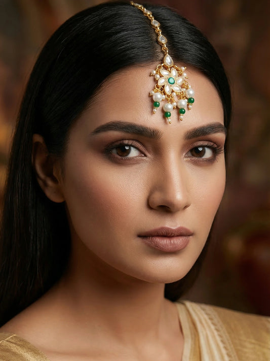 Aadita Gold Plated Teardrop Kundan Chain Mangtika with Flower Pendant and Green Pearl Drops