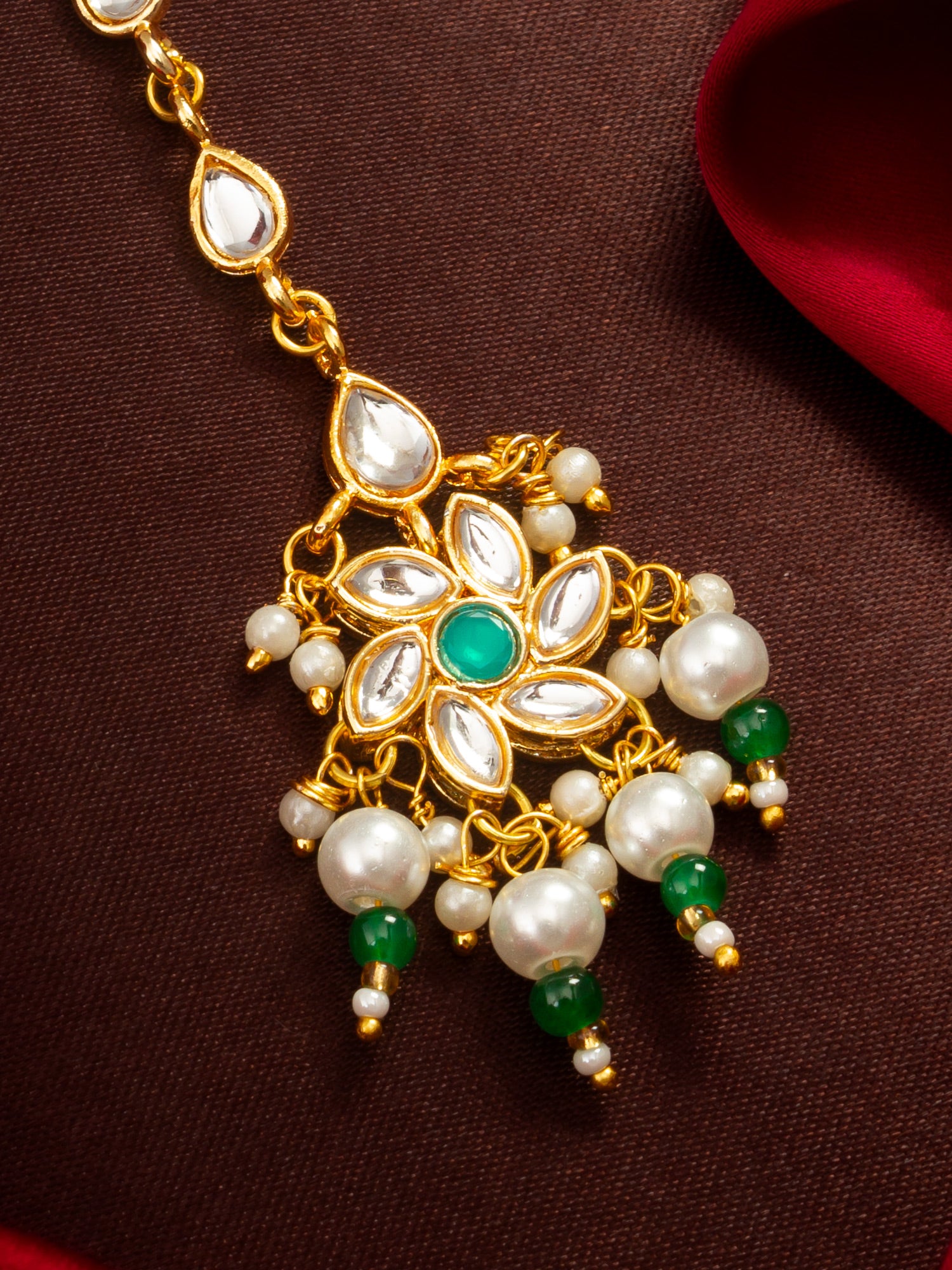 Aadita Gold Plated Teardrop Kundan Chain Mangtika with Flower Pendant and Green Pearl Drops