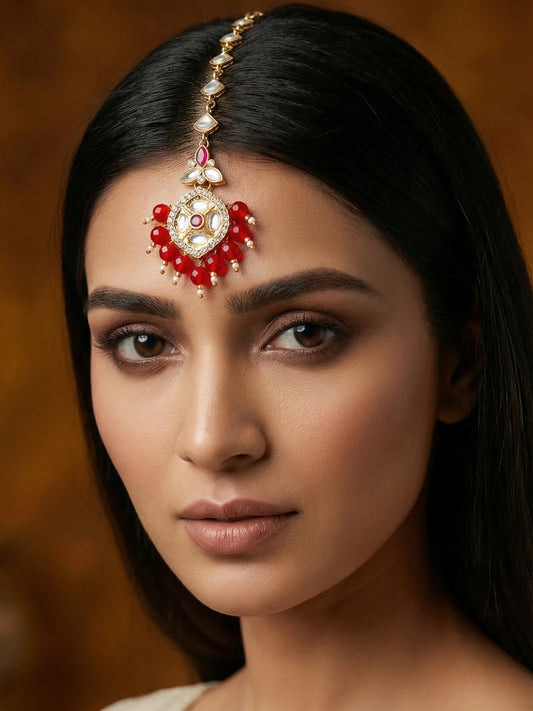 Aadita Gold Plated Half-Moon Kundan Chain Mangtika with Hexagonal Pendant and Red Bead Fringe