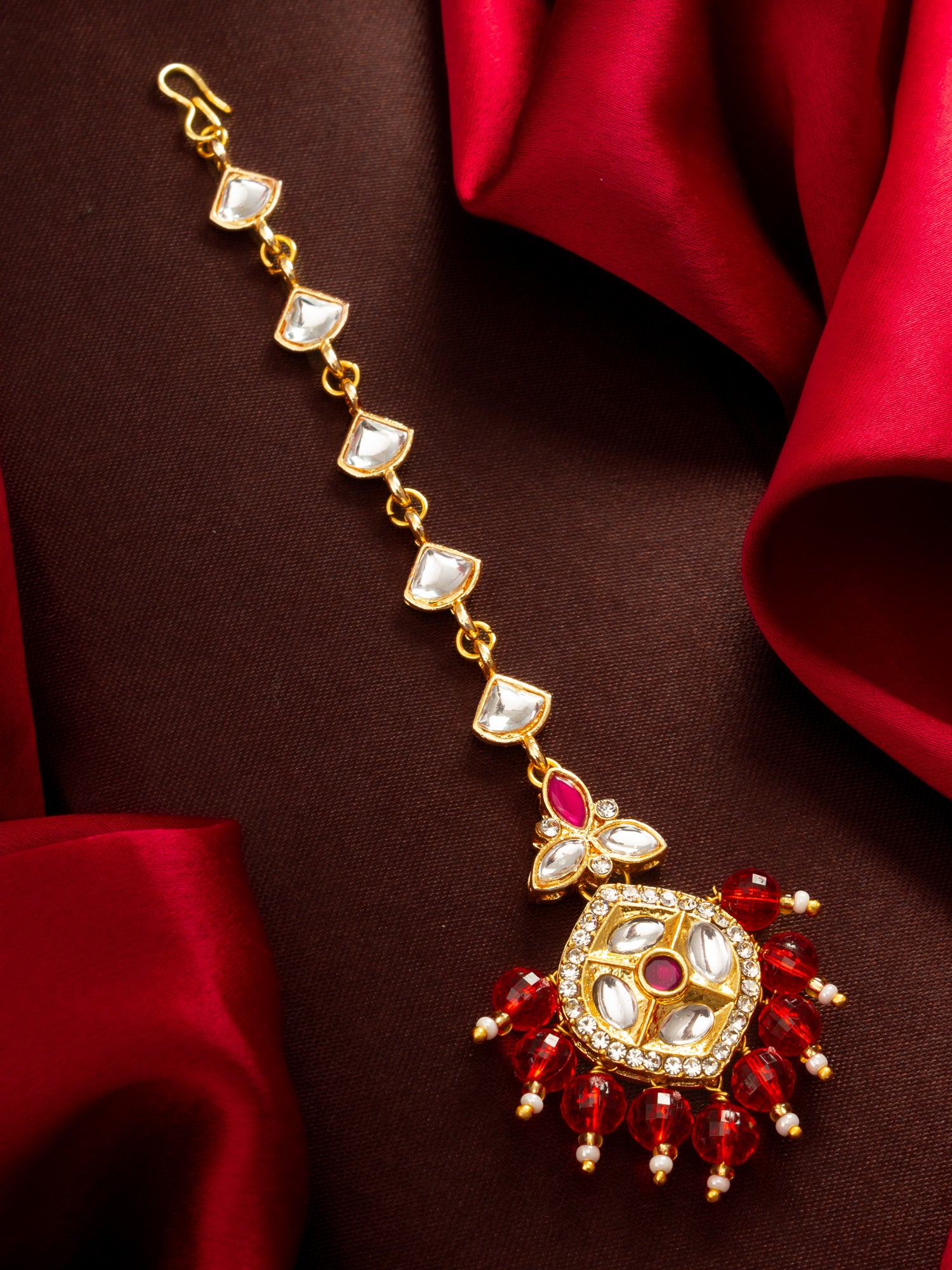 Aadita Gold Plated Half-Moon Kundan Chain Mangtika with Hexagonal Pendant and Red Bead Fringe