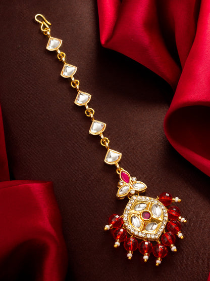 Aadita Gold Plated Half-Moon Kundan Chain Mangtika with Hexagonal Pendant and Red Bead Fringe