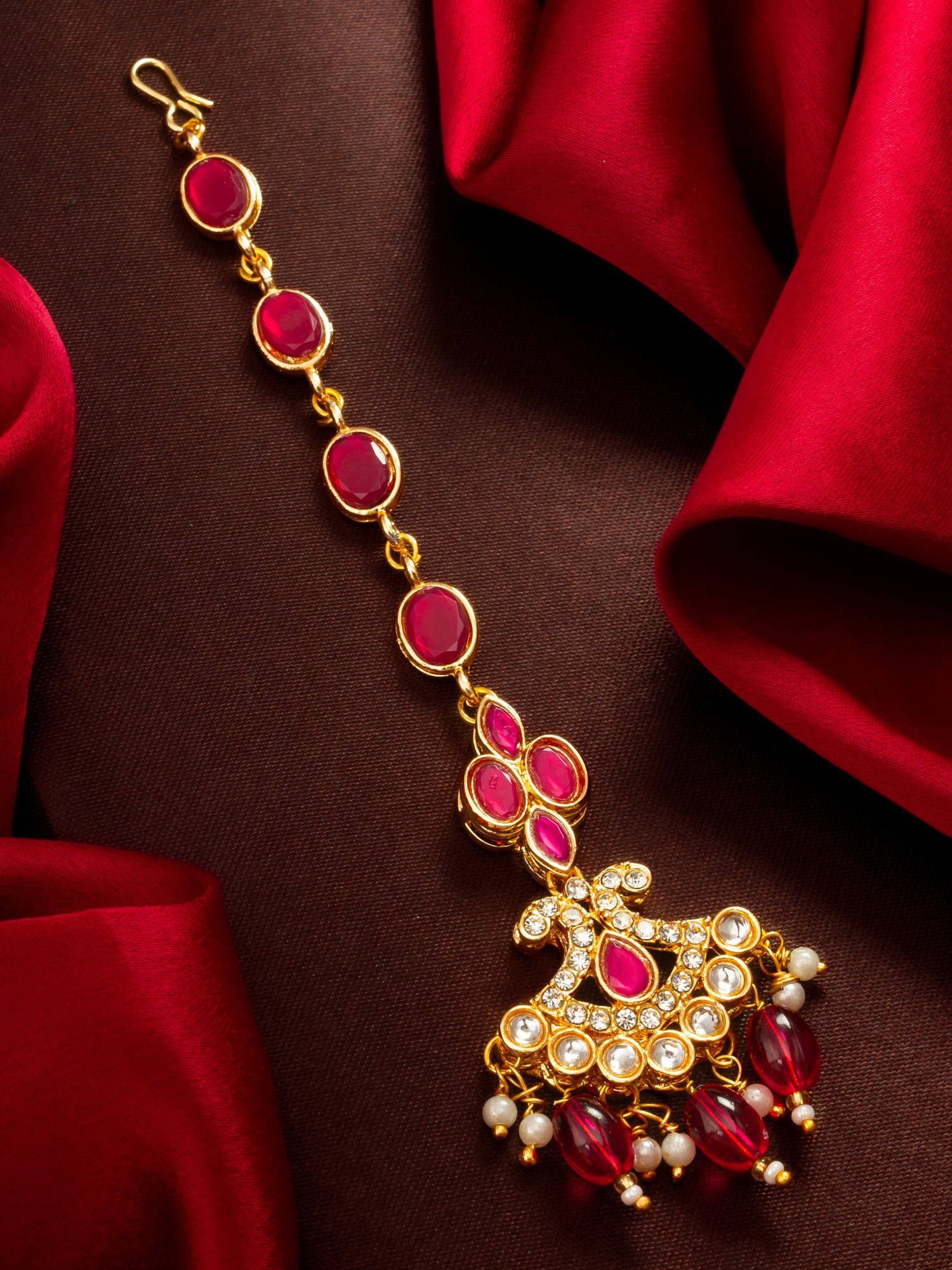 Aadita Gold Plated Ruby Oval Chain Mangtika with Cross Kundan Pendant and Pink Bead Drops