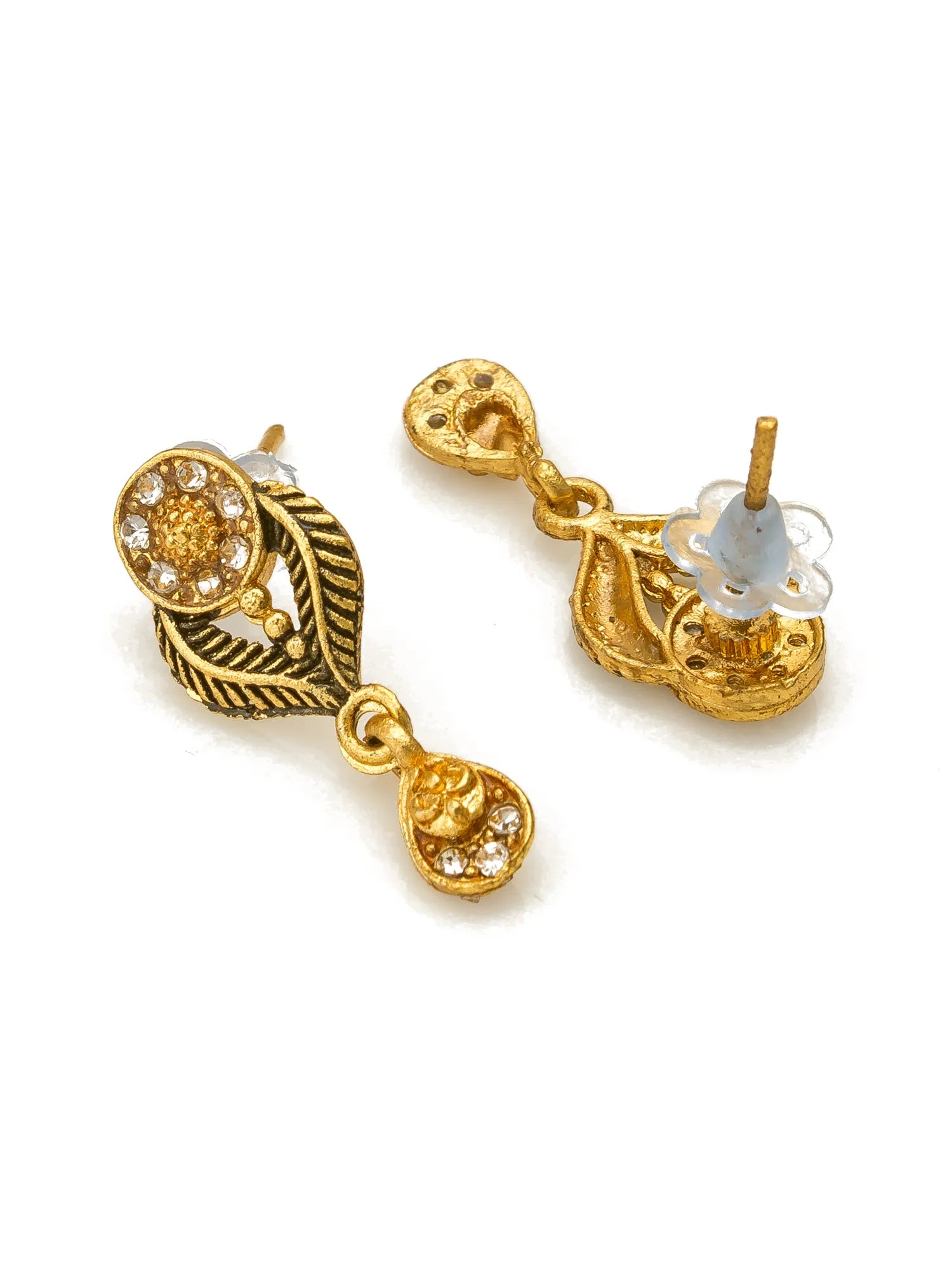 A pair of gold-toned traditional Indian earrings with intricate filigree work, small clear stones, and a teardrop-shaped drop, shown on a white background.