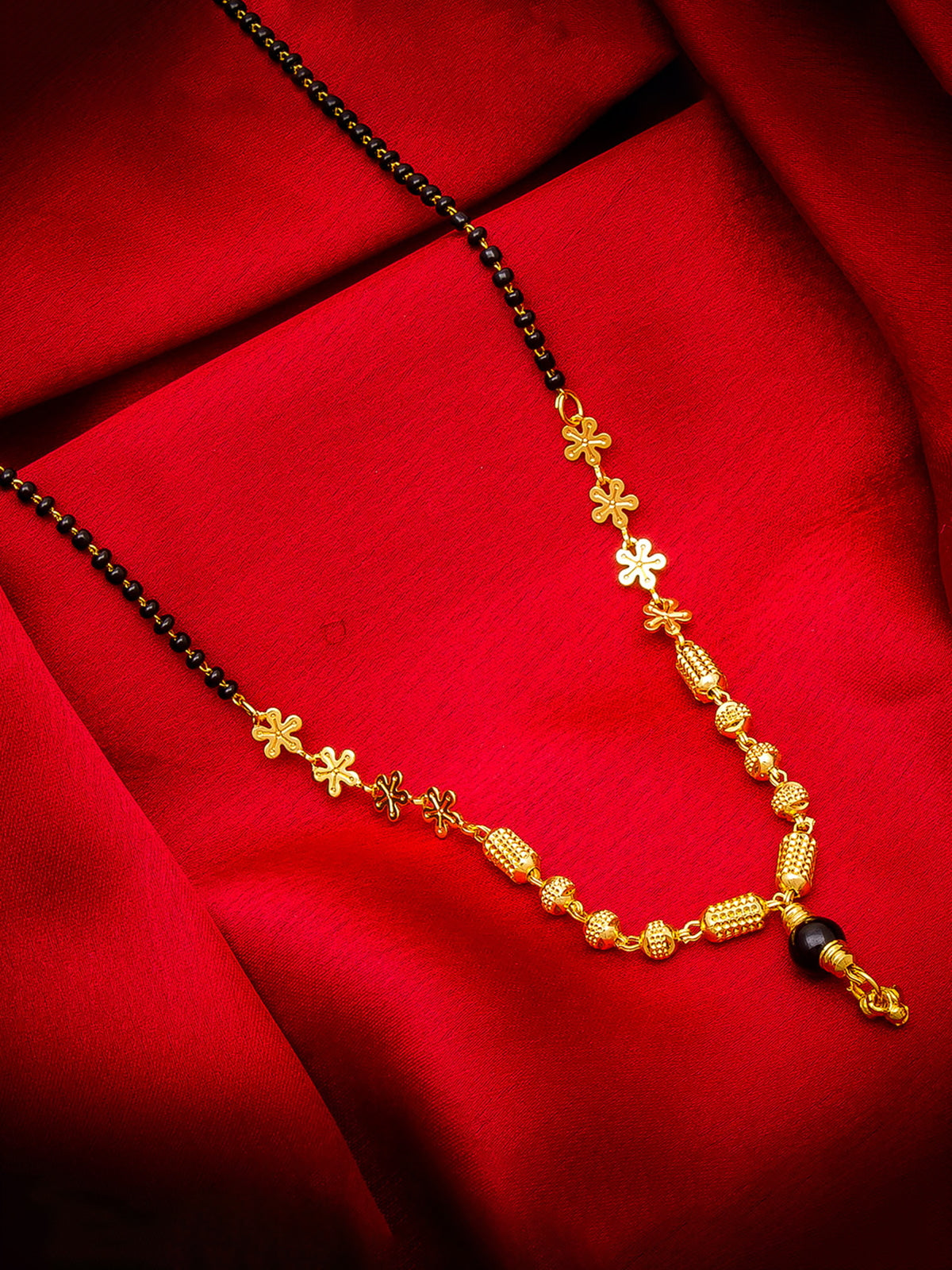 Aadita Gold-Toned Traditional Mangalsutra with Black Beads, Floral and Textured Barrel Pendants for Daily Wear