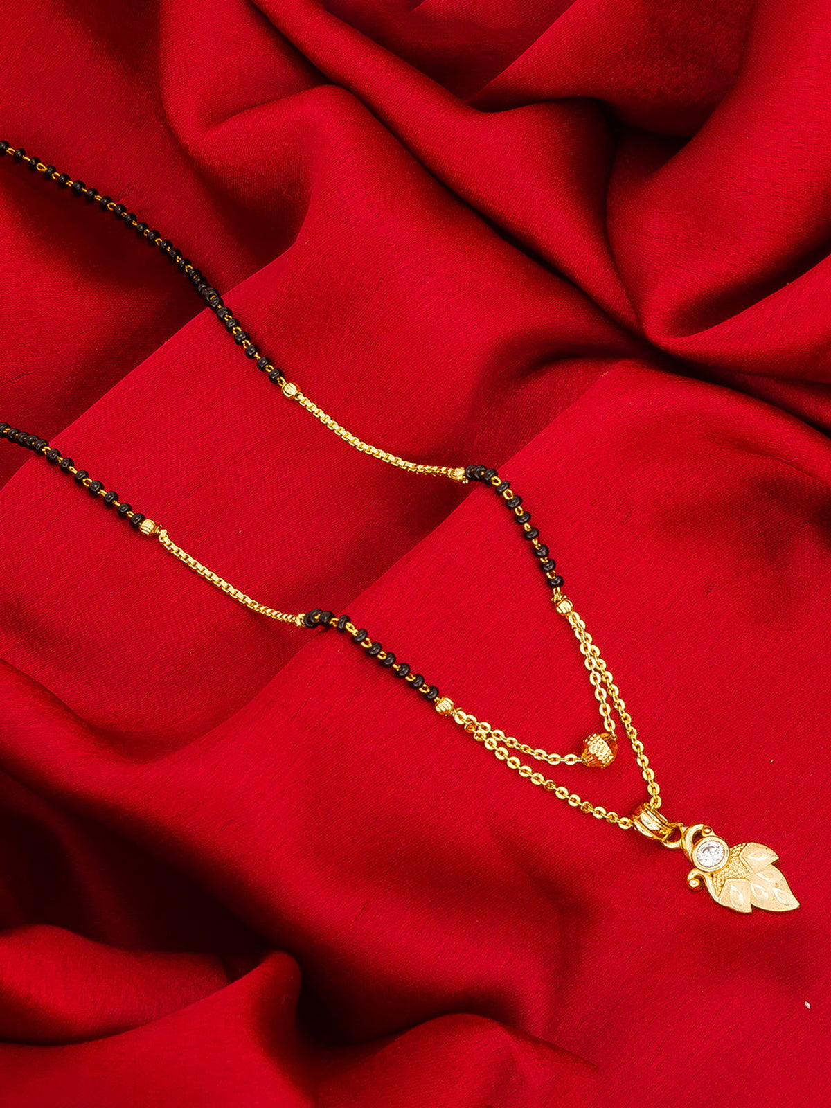 Aadita Daily Wear Gold-Toned Leaf and Scroll Mangalsutra with Single Stone Pendant and Black Beads Dual Chain