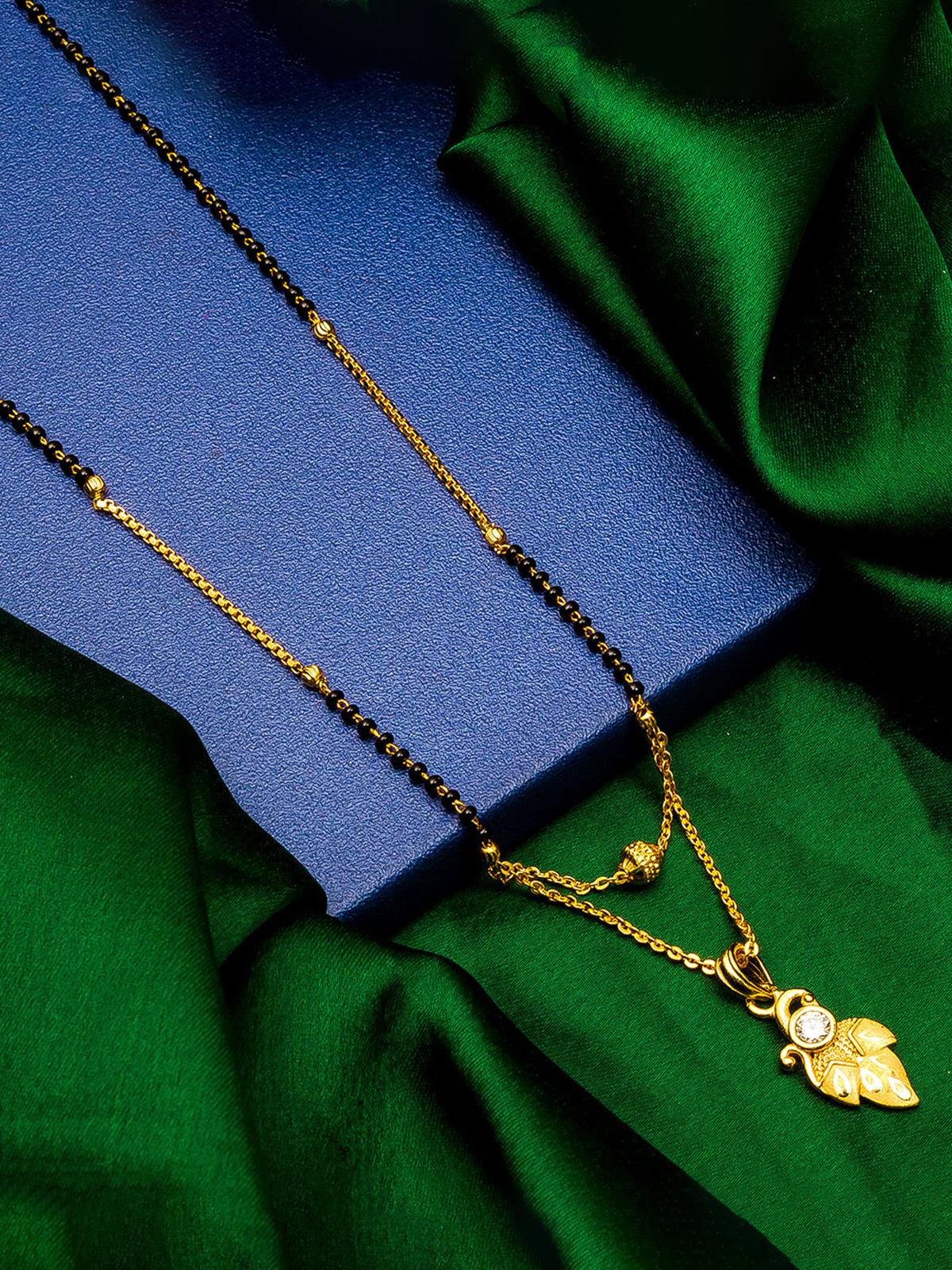 Aadita Daily Wear Gold-Toned Leaf and Scroll Mangalsutra with Single Stone Pendant and Black Beads Dual Chain