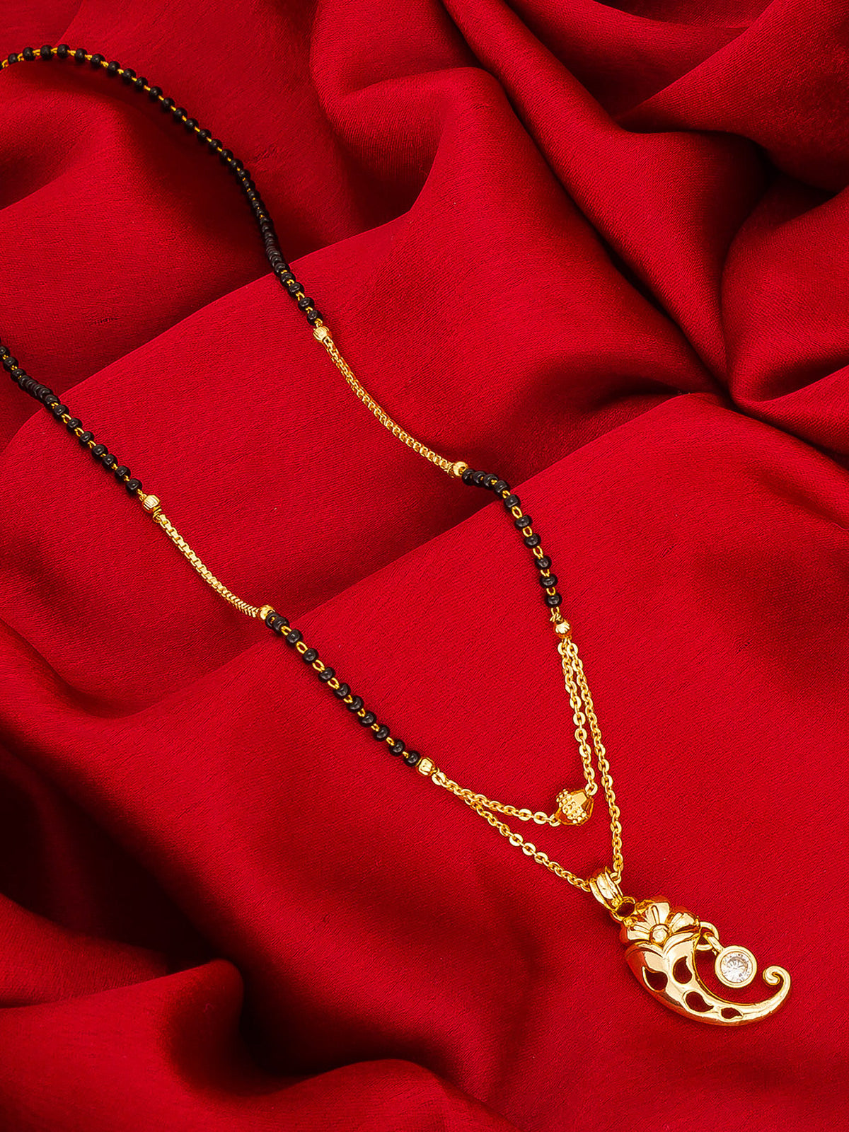 Aadita Gold-Toned Floral Mangalsutra with Black Beads and Stone Pendant for Daily Wear