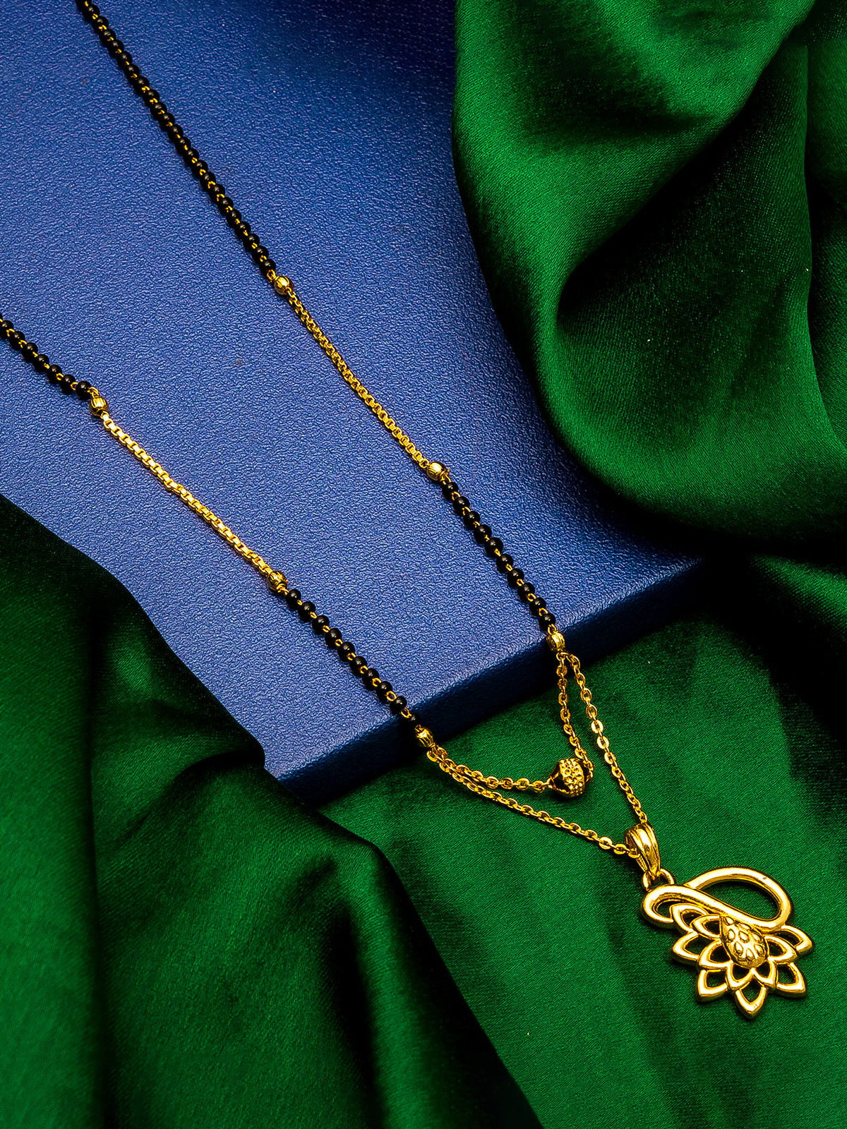 Aadita Gold-Toned Lotus and Teardrop Cutwork Mangalsutra with Black Beads and Dual Chain