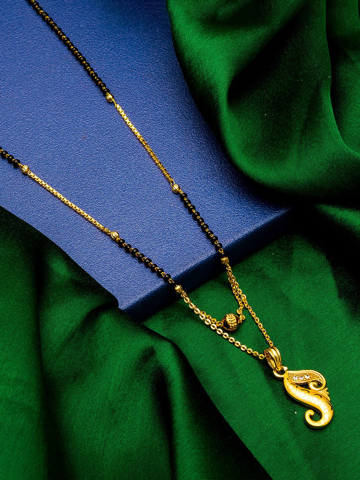 Aadita Gold-Toned Paisley Motif Mangalsutra with Black Beads and Dual-Layer Chain