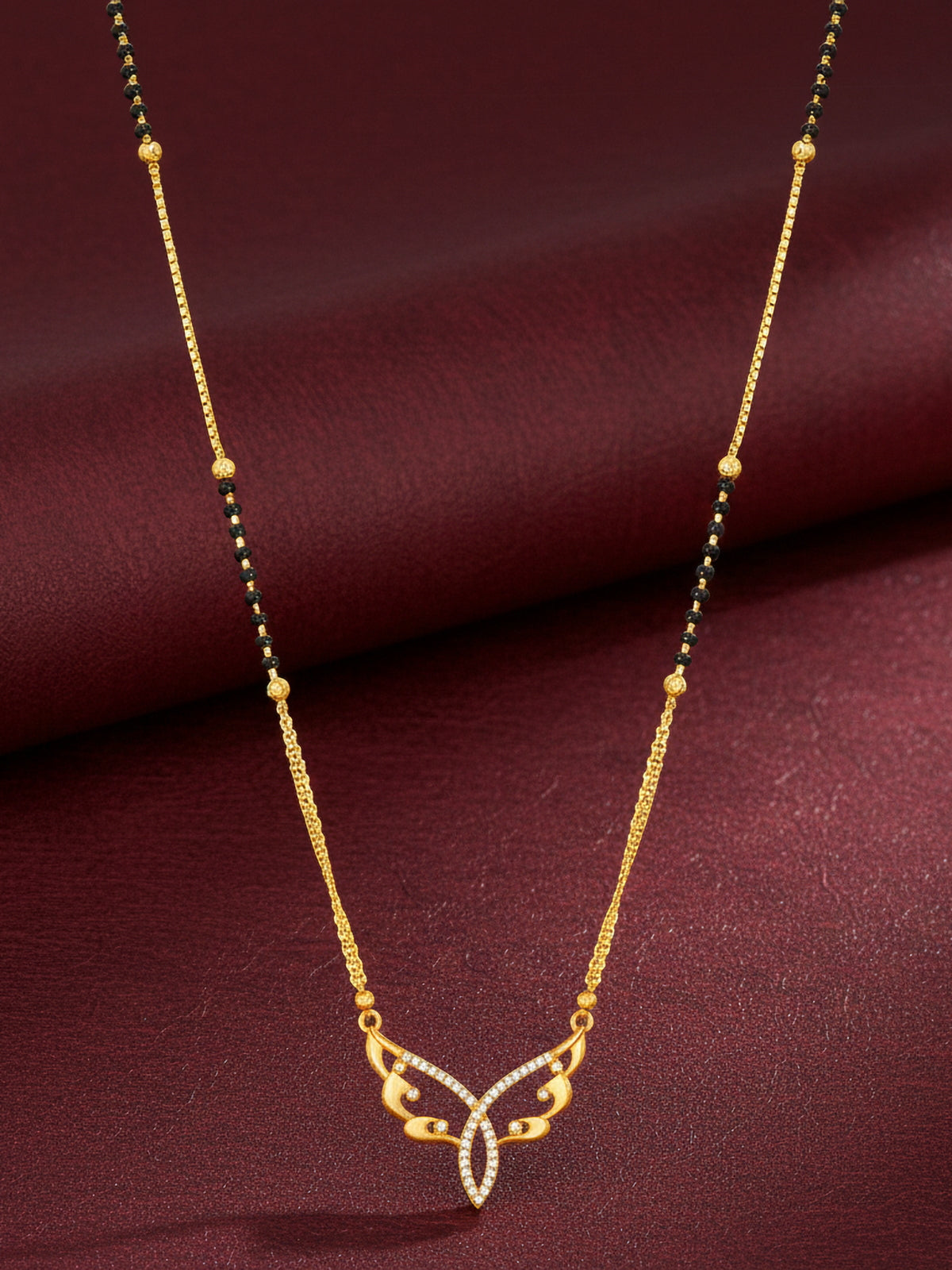 Aadita Gold-Toned Butterfly Wing Mangalsutra with Black Beads and Dual Chain For Special Occasion