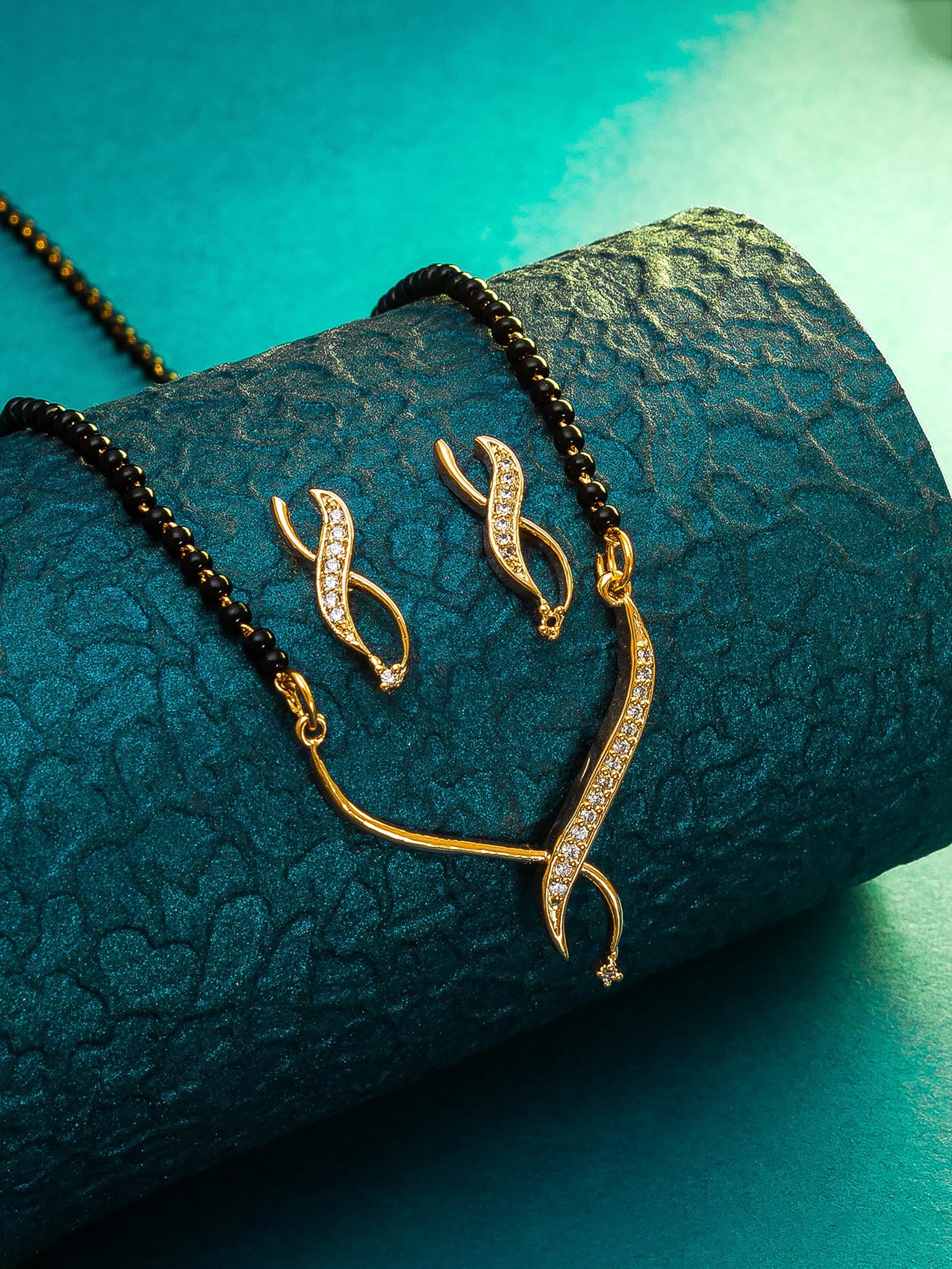 Aadita Office Wear Gold-Toned Twisted Ribbon Mangalsutra Set with Black Beads Chain and Matching Earrings