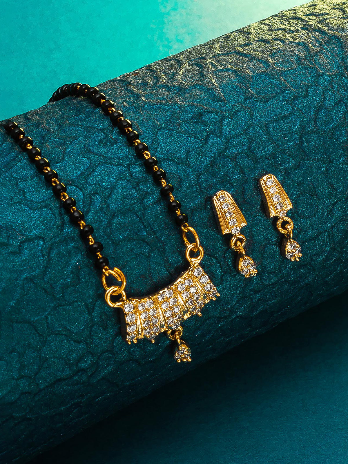 Aadita Gold-Toned Stone Mangalsutra Set with Black Beads Chain and Matching Earrings