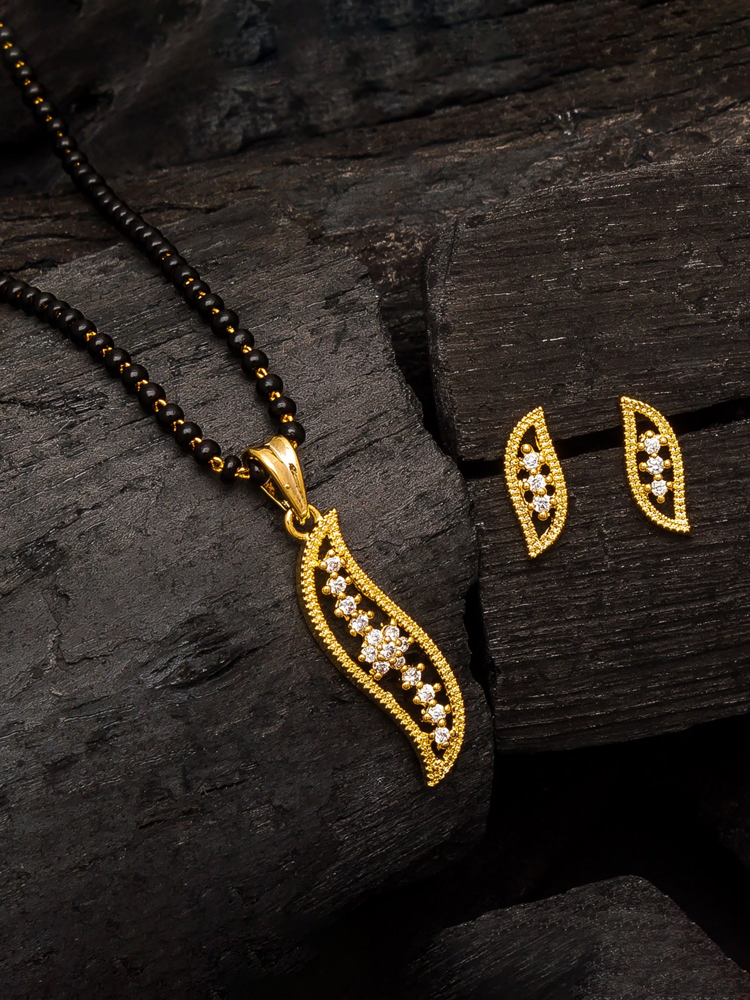 Aadita Gold-Plated AD Stone Leaf Mangalsutra Pendant Set with Black Bead Chain and Matching Earrings