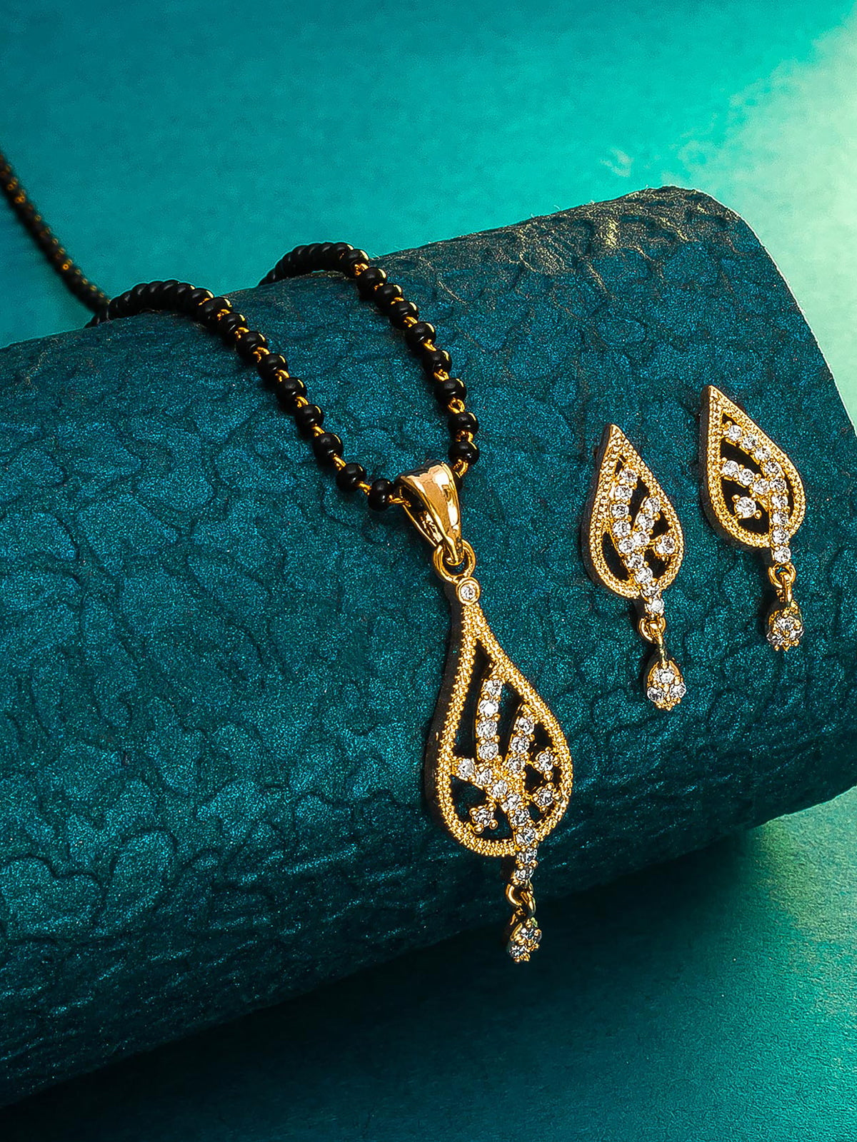 Aadita Office Wear Gold-Toned AD Stone Mangalsutra Set with Leaf Pendant and Matching Earrings