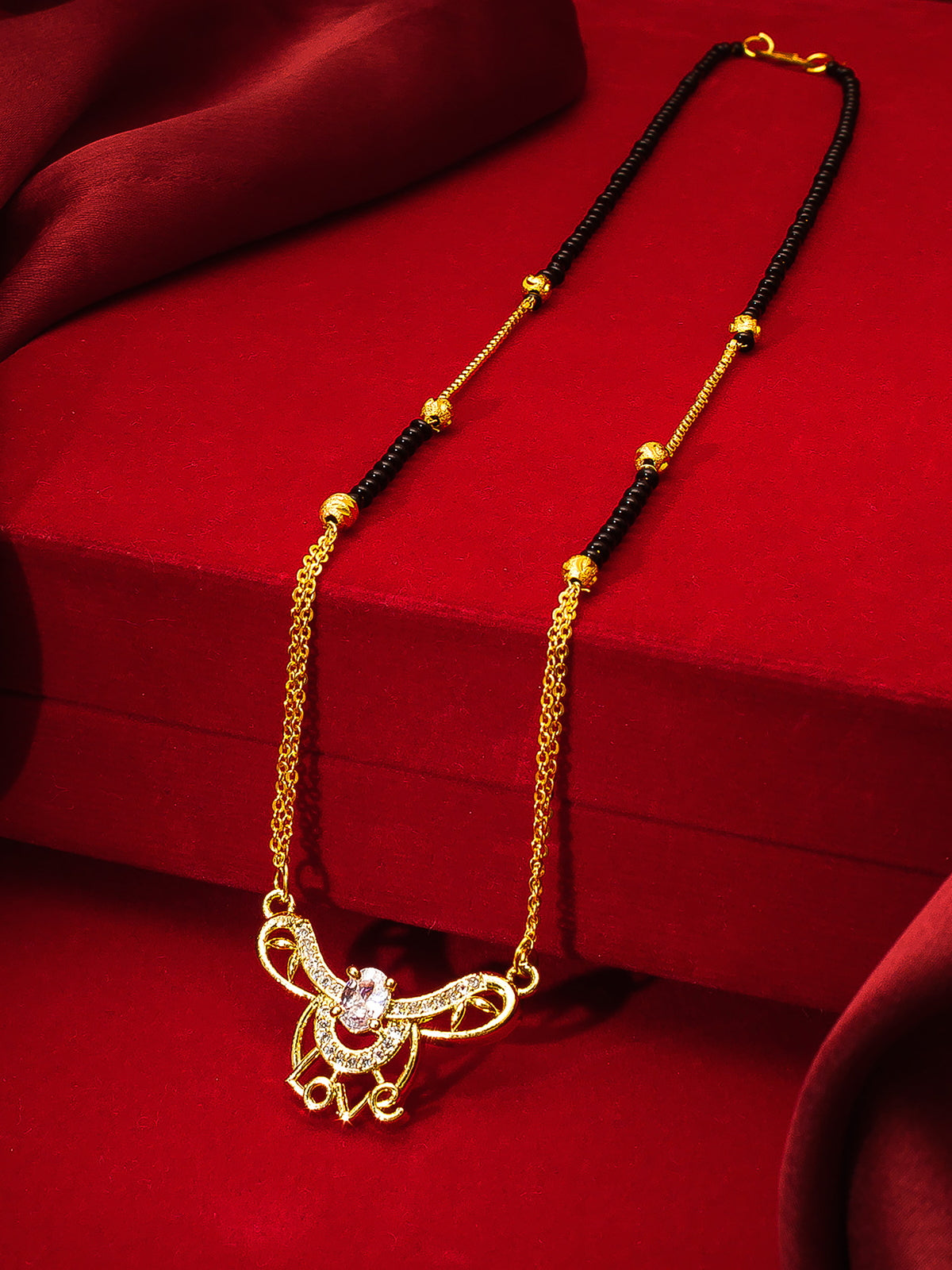 Aadita Festive Gold-Toned Black Bead Mangalsutra with AD Love Script Pendant