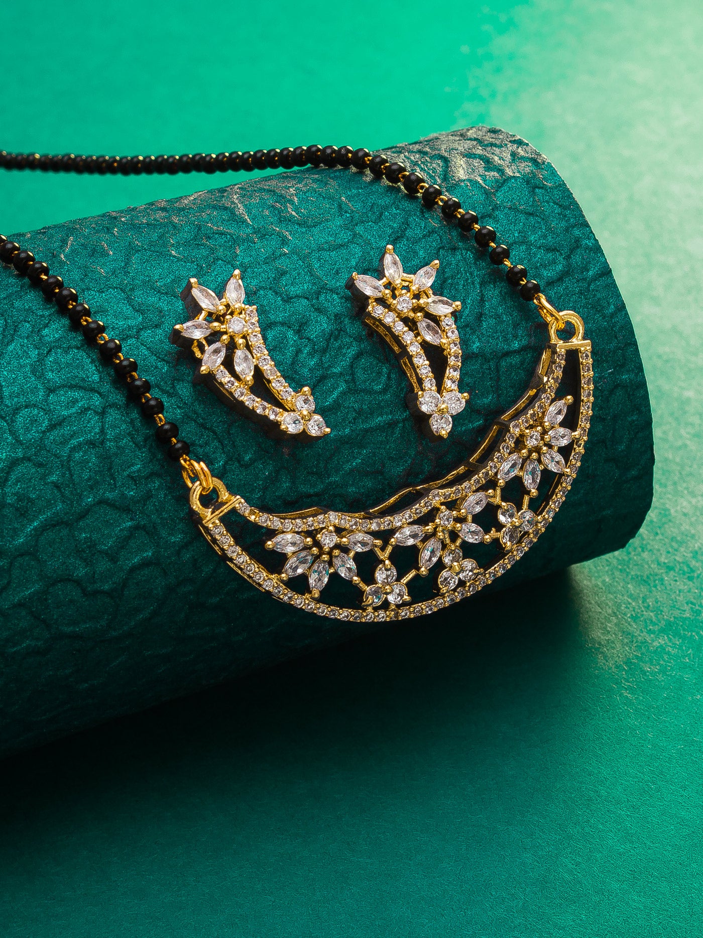 Aadita Festive Gold-Toned AD Stone Mangalsutra Set with Crescent Pendant and Black Bead Chain