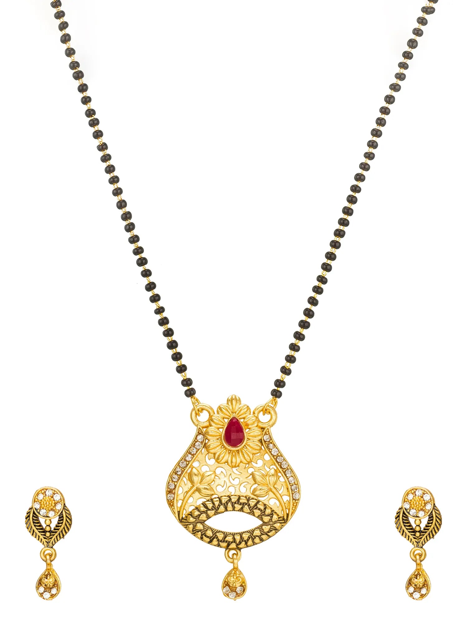 Gold-toned traditional necklace and matching earrings set with a red teardrop stone accent on a white background.