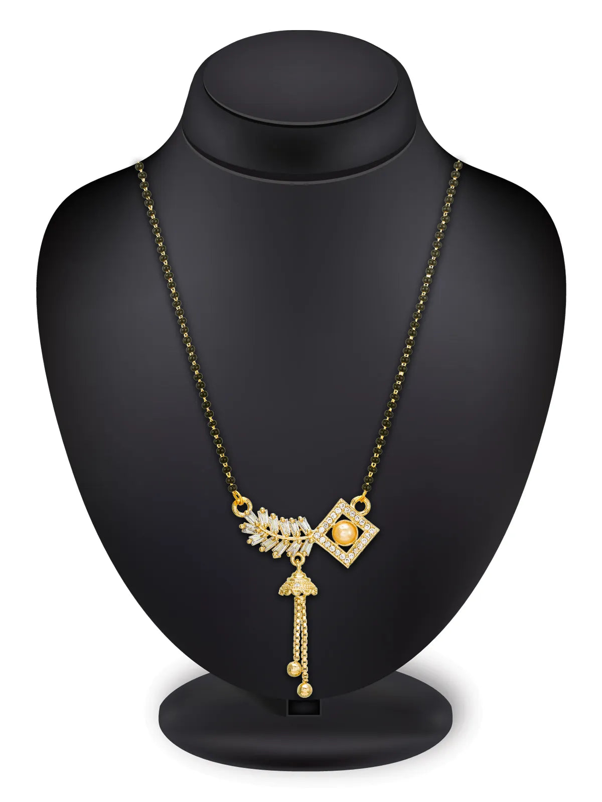 Gold necklace with a geometric pendant and dangling chain, displayed on a matte black jewelry bust against a white background.