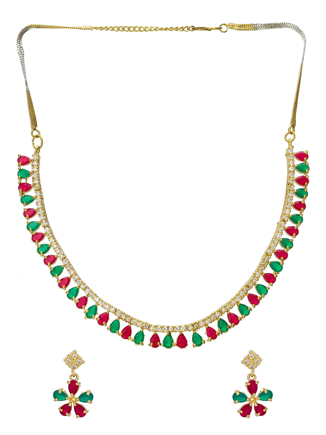 Gold-tone necklace and matching earrings set with alternating red and green teardrop gemstones and clear stones, displayed on a dark surface with a blue satin cloth.