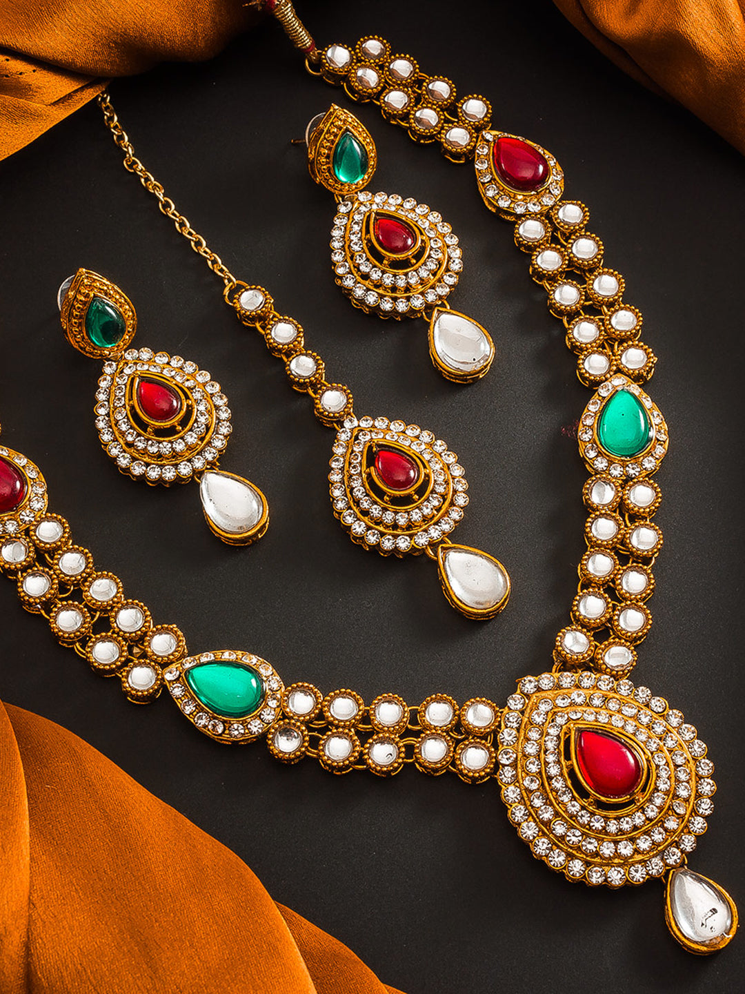 Aadita Antique Gold Kundan Necklace Set with Stones, Earrings and Maang Tikka