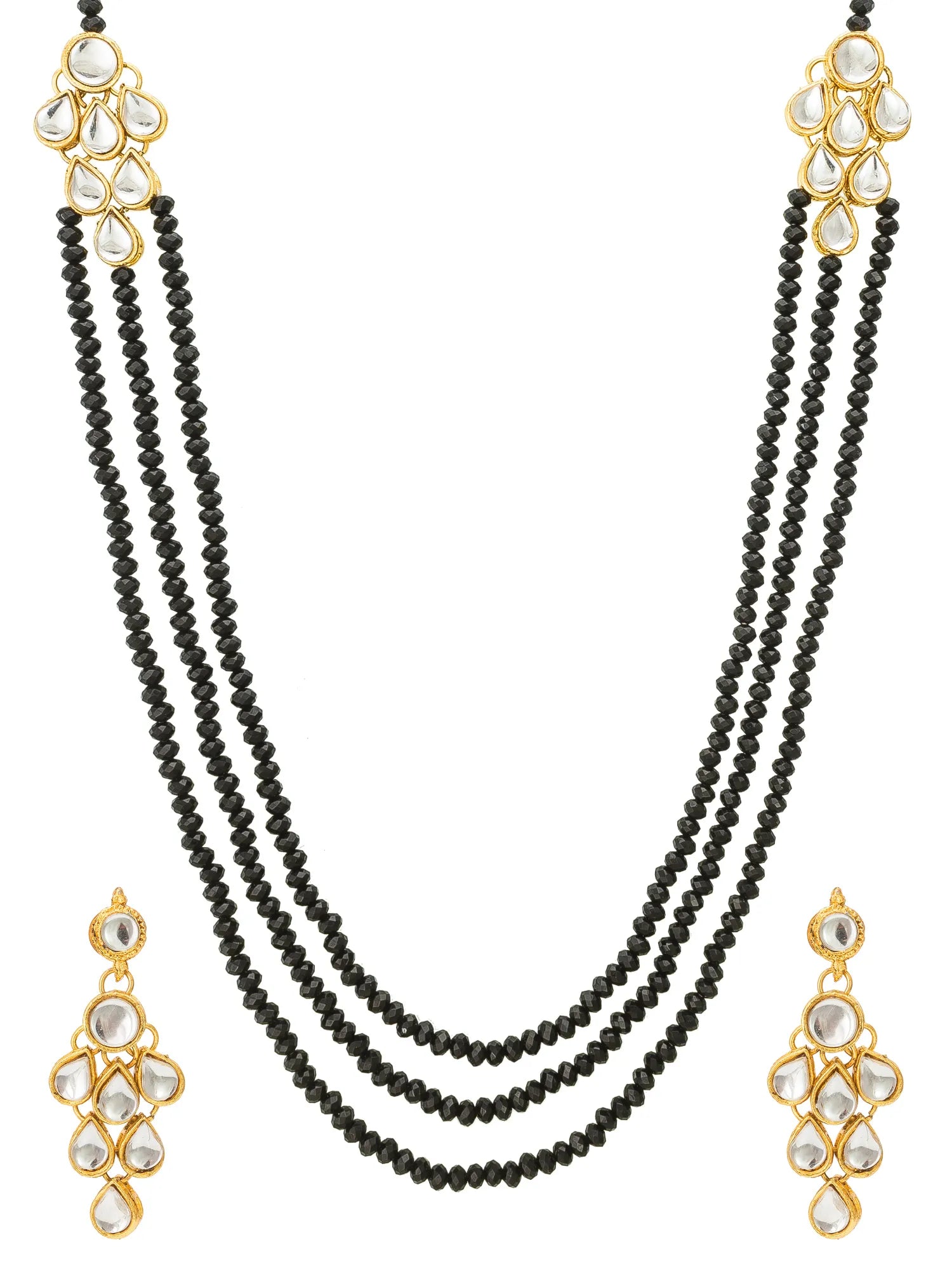 A traditional Indian jewelry set featuring a three-strand black beaded necklace with gold-plated floral end caps and clear stones, accompanied by matching drop earrings.