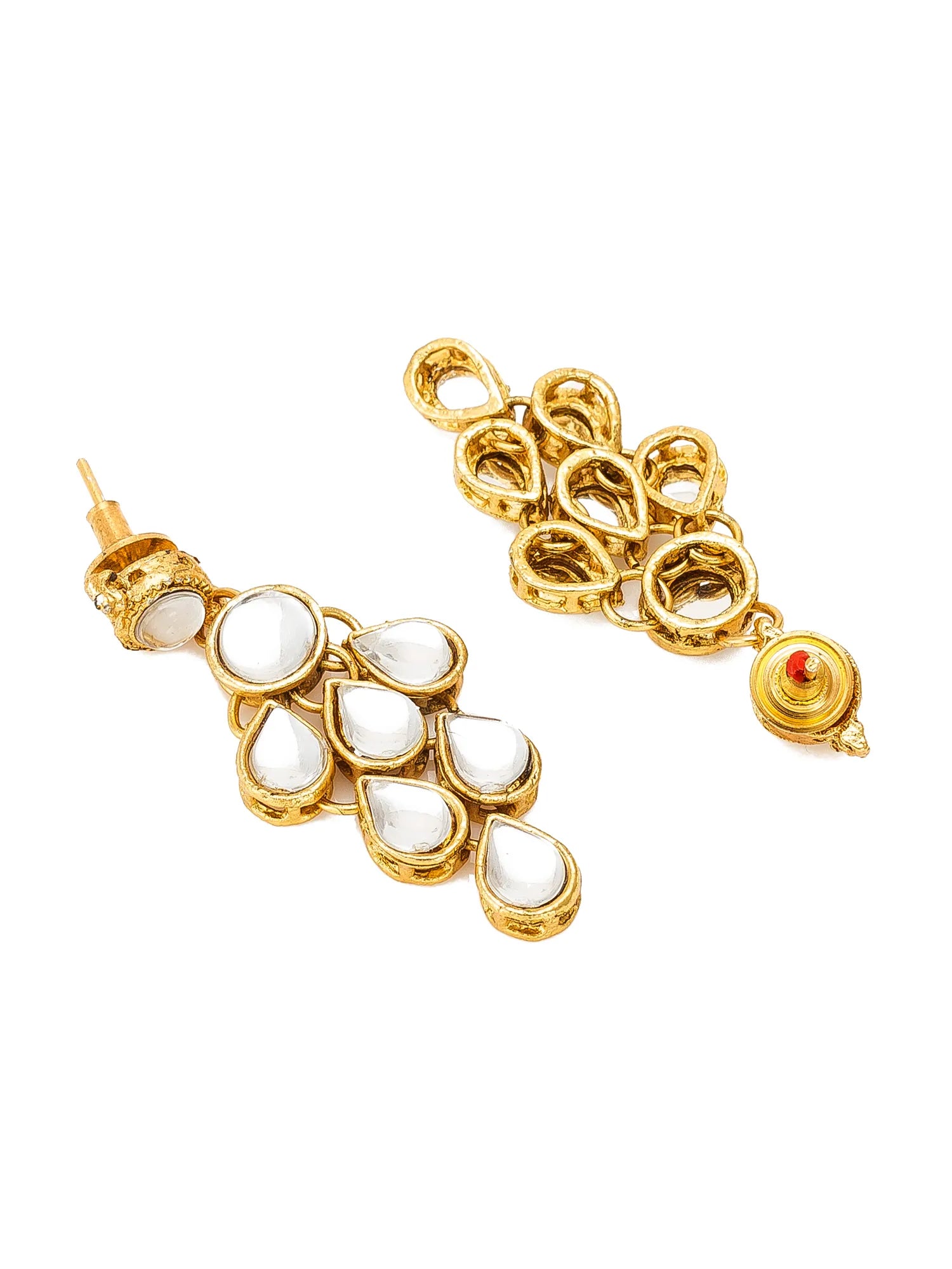 A pair of gold-plated dangle earrings featuring white teardrop-shaped stone inlays and a small red accent bead, shown on a plain white background.
