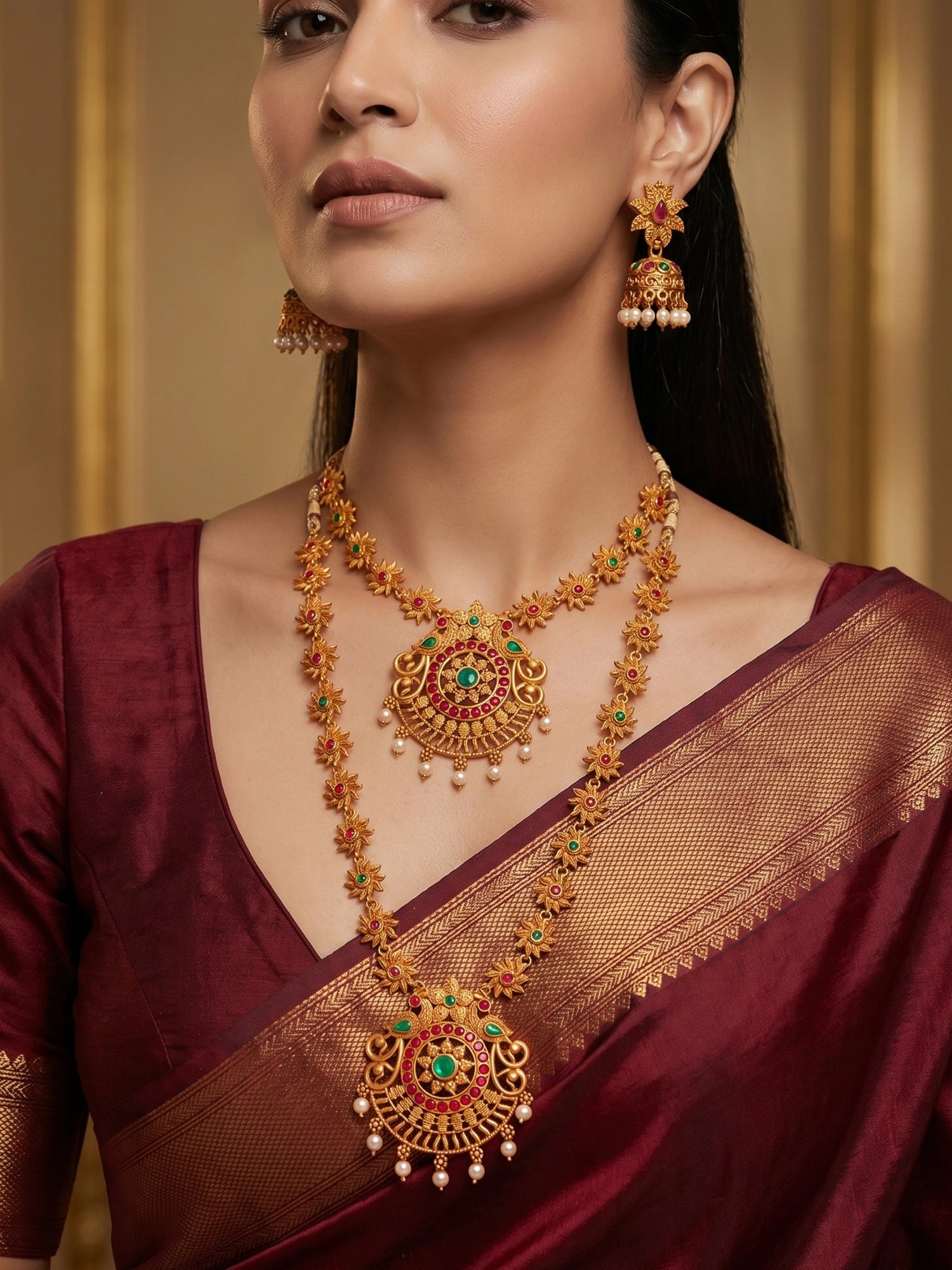 Aadita Gold-Tone Sun Motif Double Layer Haram Necklace Set with Emerald Stones and Jhumka Earrings