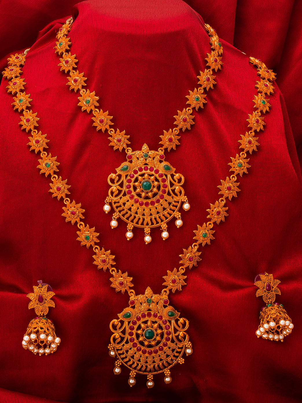 Aadita Gold-Tone Sun Motif Double Layer Haram Necklace Set with Emerald Stones and Jhumka Earrings