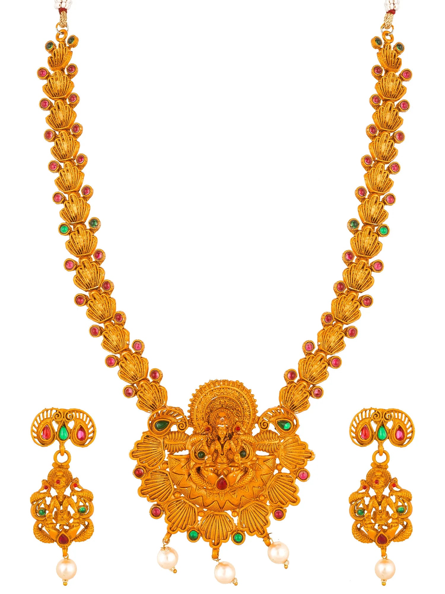 Gold-toned traditional Indian jewelry set featuring a necklace with a central deity pendant, matching drop earrings, and small pearl-like beads, accented with red and green stones on a plain white background.