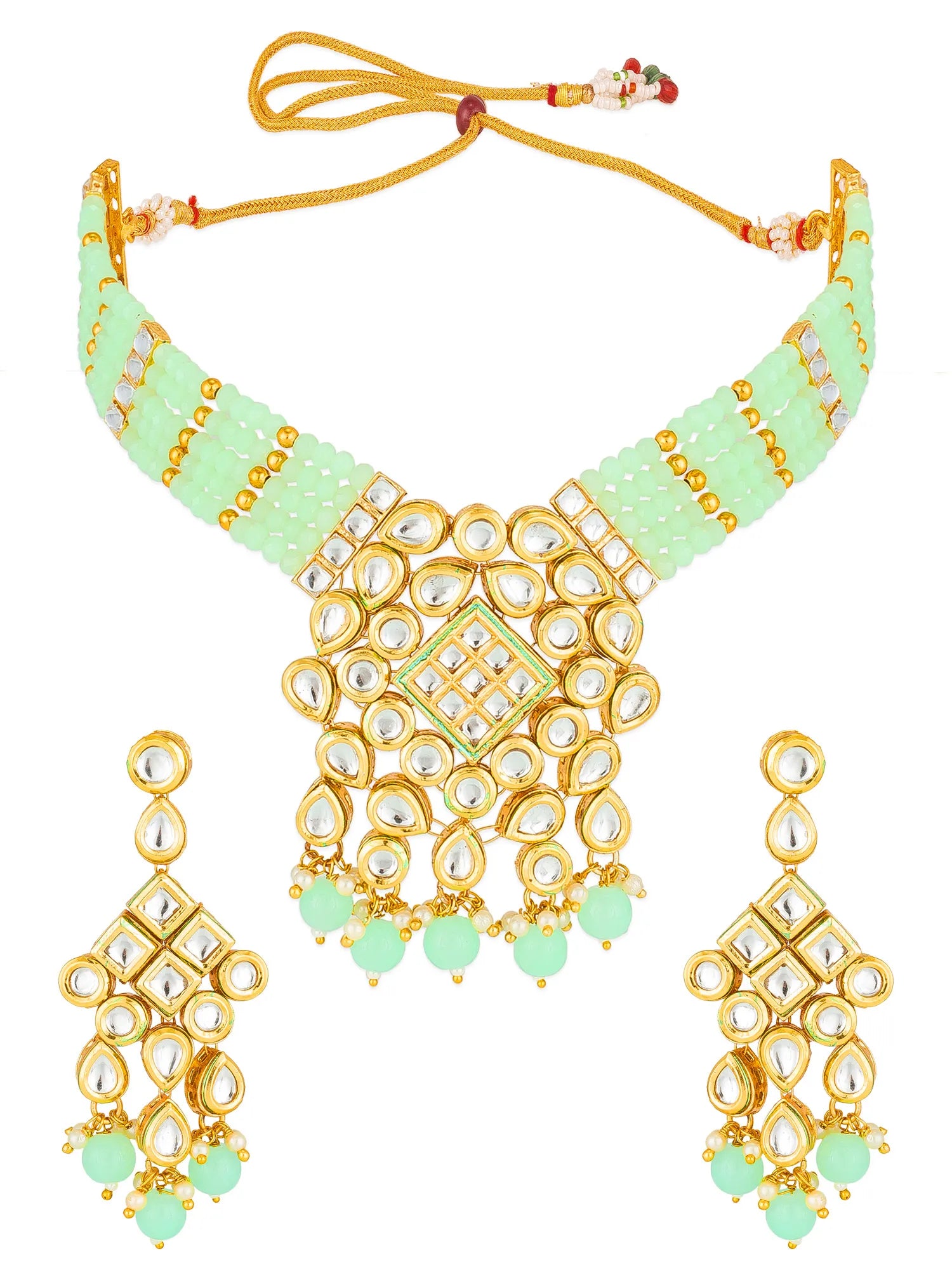A traditional Indian jewelry set featuring a gold-plated necklace with mint green beaded inlay and clear stone accents, accompanied by matching drop earrings on a plain white background.