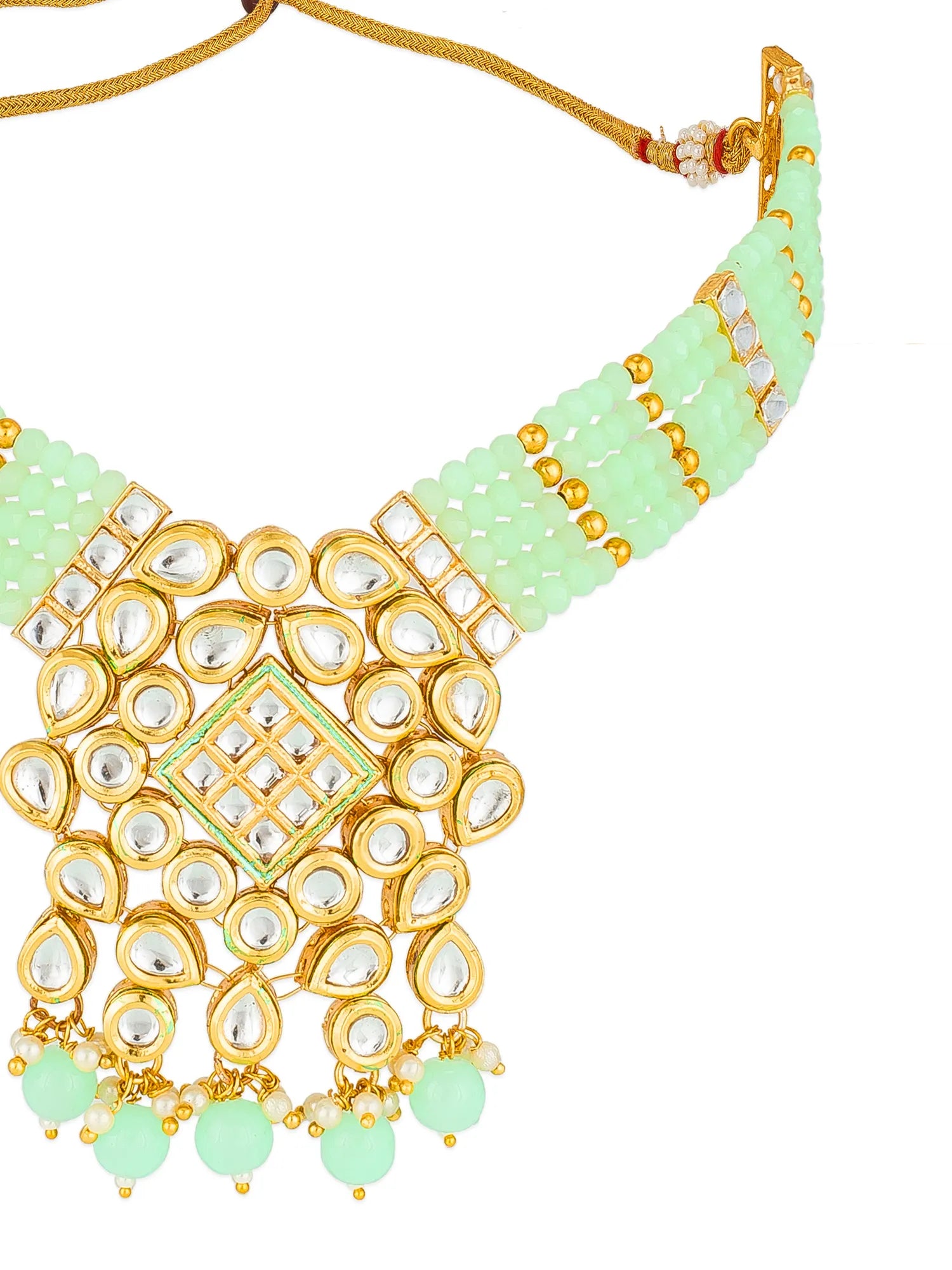 A traditional Indian statement necklace featuring mint green beads, gold-plated metal, and clear stone embellishments, shown against a plain white background.