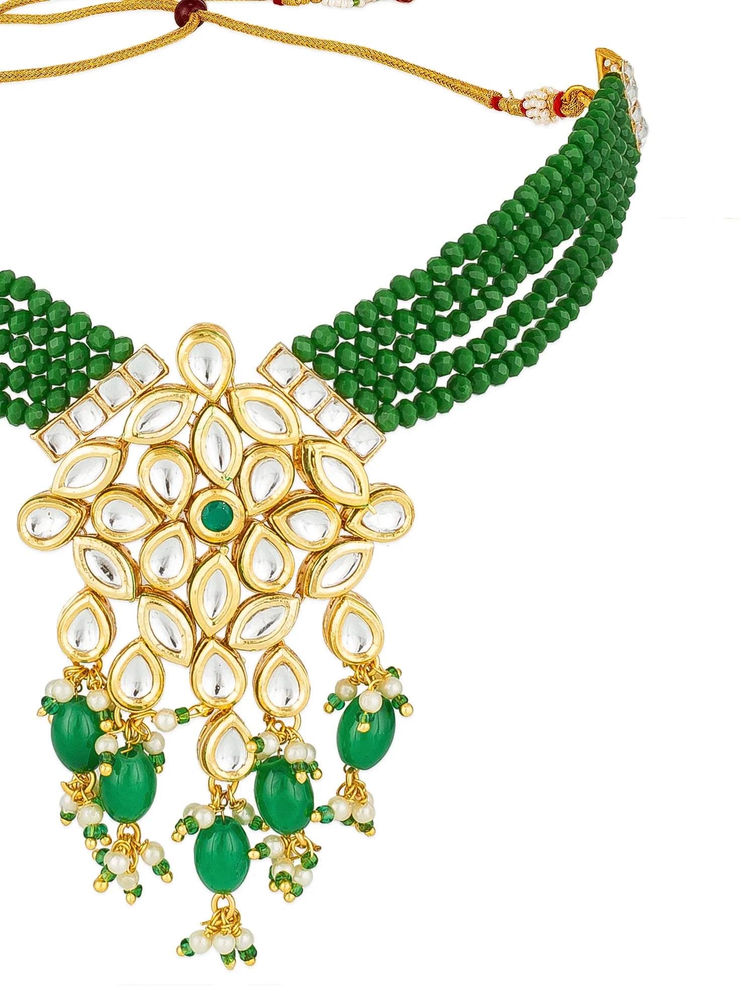 Gold and green beaded necklace with a large floral kundan pendant featuring clear stones and dangling green bead drops, shown on a white background.