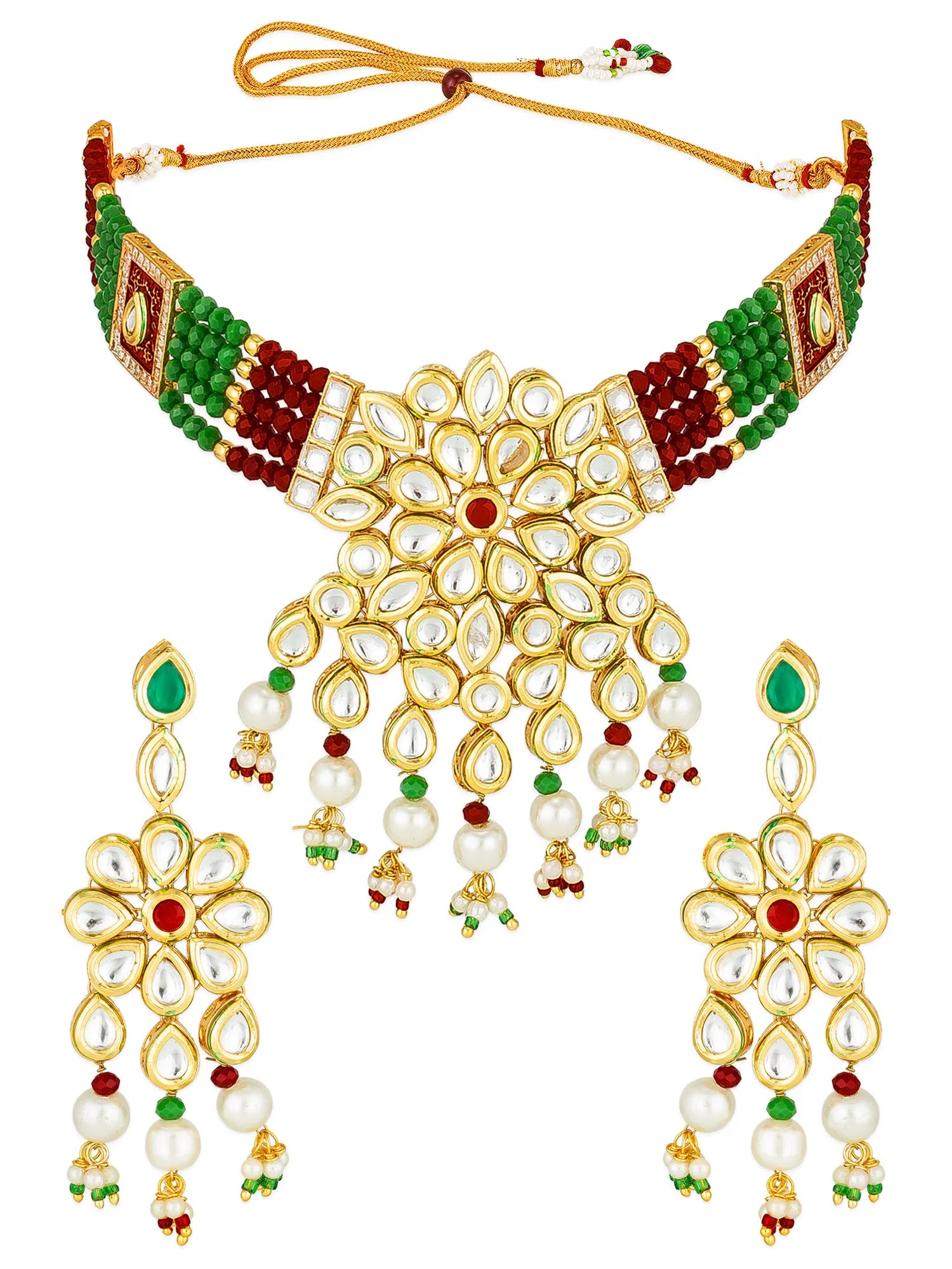 Gold-tone kundan necklace and matching drop earrings decorated with white faux pearls, green beads, and red accents on a plain white background.