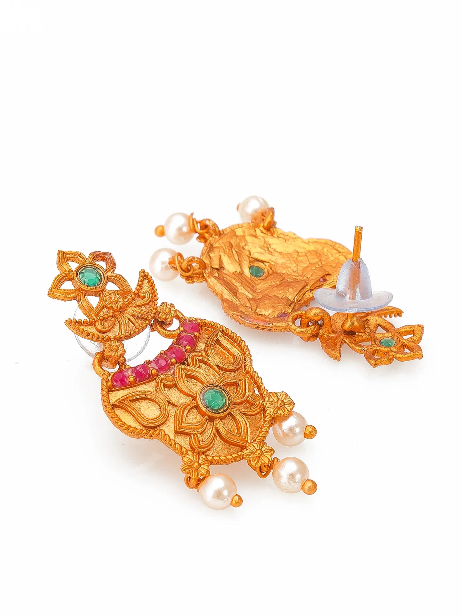 A pair of ornate gold-toned traditional earrings decorated with green stones, pink stones, and small white pearl beads, shown on a plain white background.