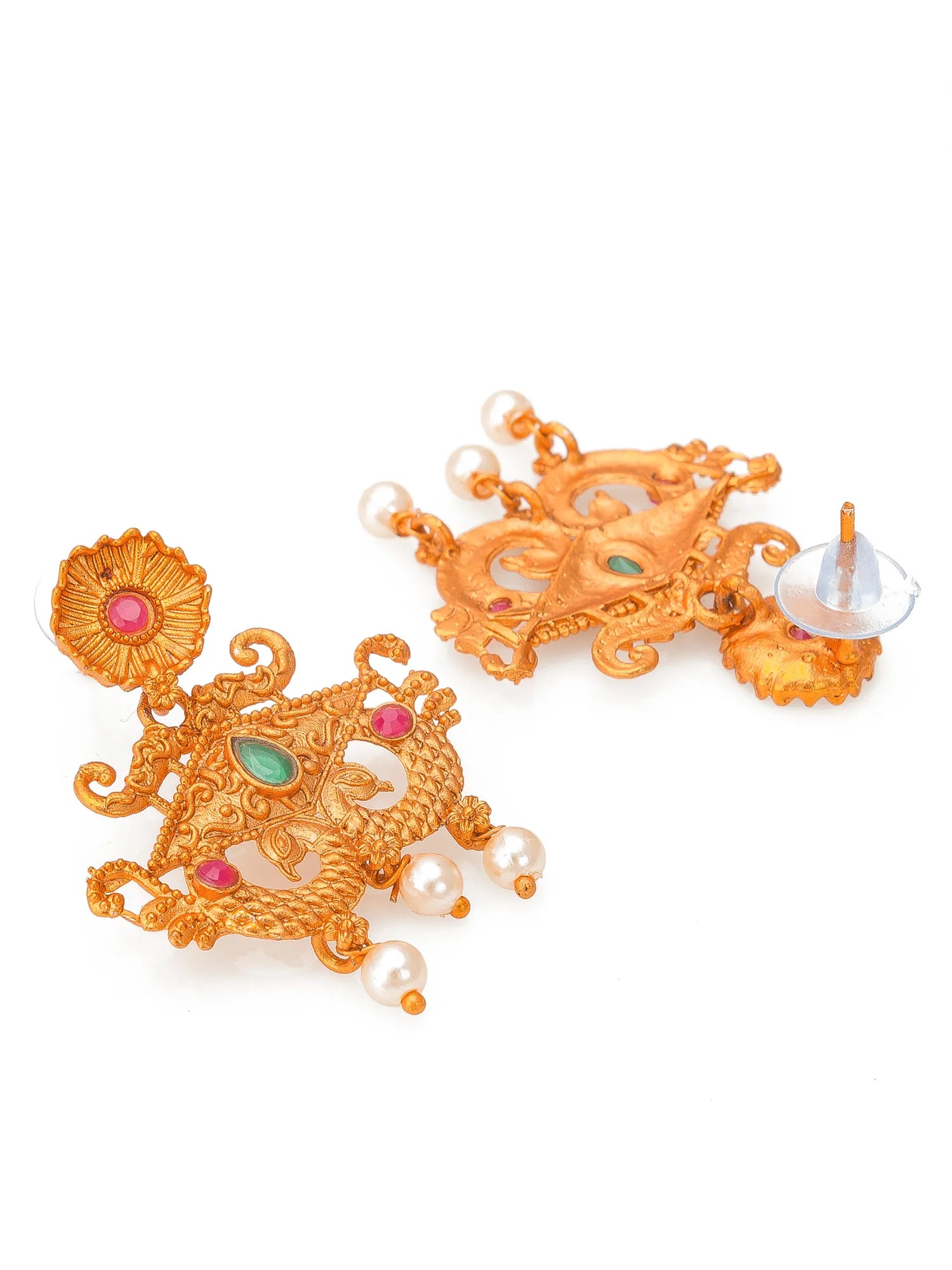 A pair of ornate gold-toned traditional Indian dangle earrings decorated with small pink and green stones and white pearl beads, shown on a plain white background.