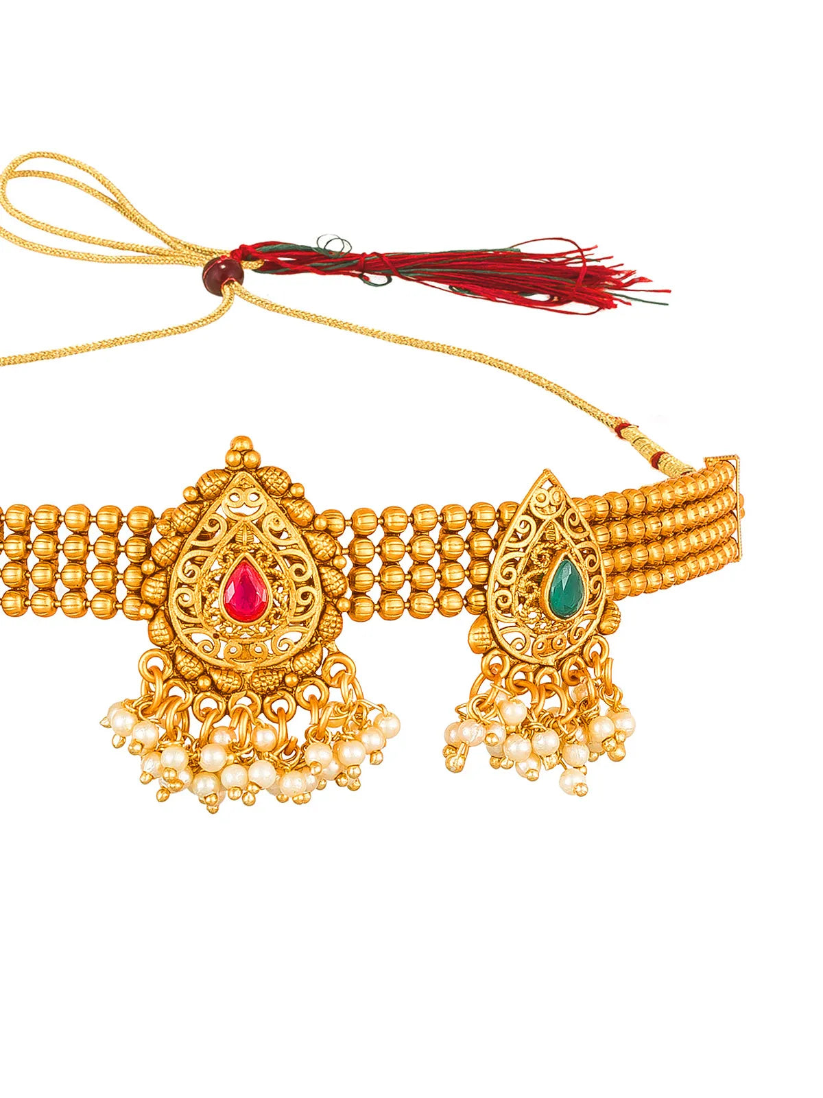Gold-toned traditional Indian jewelry set featuring a wide beaded collar with ornate teardrop-shaped pendants, one with a red stone and one with a green stone, adorned with dangling pearl-like beads, shown on a white background with a red tassel tie.