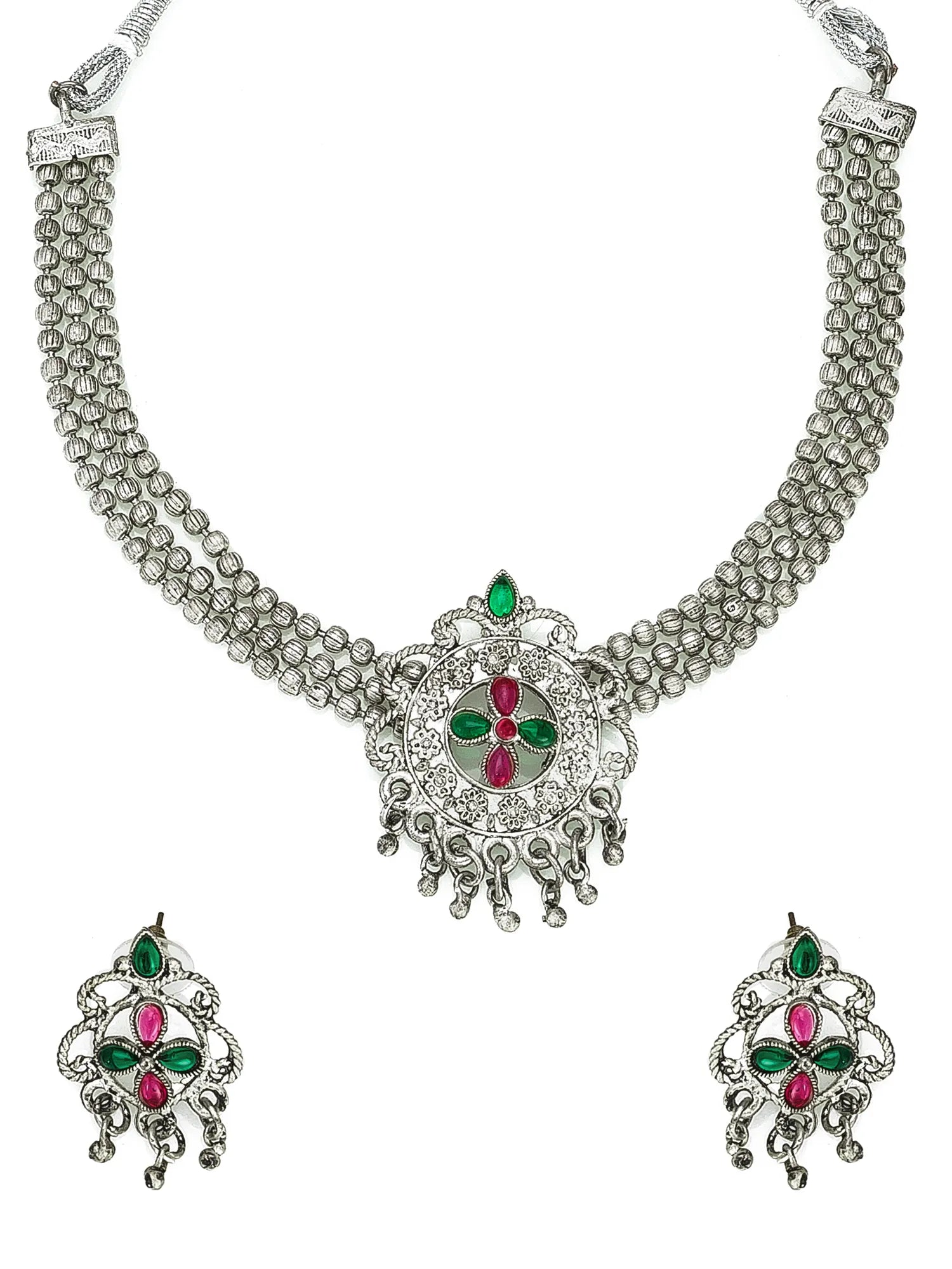 Silver necklace with green and red stones on a white background